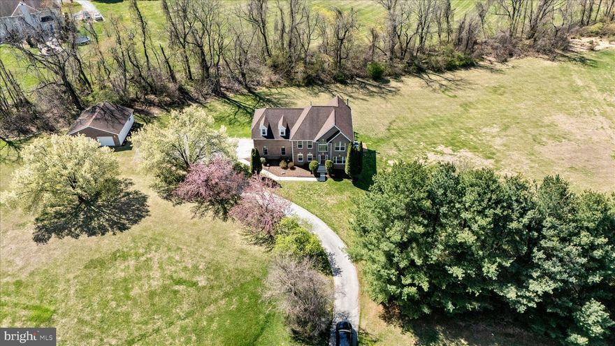 Buyer financing fell through last minute. Price improved, this is your opportunity! Nestled in a quiet, well-established community, this beautifully maintained home offers the perfect blend of comfort, space, and convenience. Thoughtfully designed with everyday living and entertaining in mind, the home features bright, open living areas filled with natural light and a functional layout that suits a variety of lifestyles. The main level offers generous living and dining spaces, ideal for gatherings or relaxing at home. The kitchen provides ample cabinetry, soft-close cabinets, and counter space, with a thick quartz island, countertops, backsplash, and top-of-the-line stainless steel appliances. Flowing seamlessly into the adjacent area is the living room, with two-story ceilings and a modern chandelier that makes a statement for easy entertaining. Upstairs, you’ll find spacious bedrooms with plenty of closet space, including a comfortable primary suite designed for rest and retreat with a large walk-in closet, a modern en-suite primary bath complete with a separate soaking tub, frameless shower doors, and quad sconces adorned over dual vanities. 
Step outside and enjoy the private outdoor space with an expansive deck, additional detached 2-car garage, and patio —perfect for morning coffee, weekend barbecues, or simply unwinding after a long day. 
The large front yard is filled with tall evergreen shrubs and a long driveway leading to the house for privacy. Located close to Baltimore National Pike with plenty of shopping, dining, Centennial Park, and major commuter routes, MD-125, US-29 Columbia Pike, this home offers both tranquility and accessibility. 
Don’t miss this opportunity to own a wonderful home in one of Woodstock's desirable Edrich Manor neighborhoods.