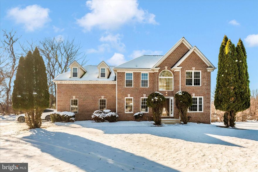 Nestled in a quiet, well-established community, this beautifully maintained home offers the perfect blend of comfort, space, and convenience. Thoughtfully designed with everyday living and entertaining in mind, the home features bright, open living areas filled with natural light and a functional layout that suits a variety of lifestyles. The main level offers generous living and dining spaces, ideal for gatherings or relaxing at home. The kitchen provides ample cabinetry, soft-close cabinets, and counter space, with a thick quartz island, countertops, backsplash, and top-of-the-line stainless steel appliances. Flowing seamlessly into the adjacent area is the living room, with double-height ceilings and a modern chandelier that makes a statement for easy entertaining. Upstairs, you’ll find spacious bedrooms with plenty of closet space, including a comfortable primary suite designed for rest and retreat with a large walk-in closet, a modern en-suite primary bath complete with a separate soaking tub, frameless shower doors, and quad sconces adorned over dual vanities. 
Step outside and enjoy the private outdoor space with 1.77 acres, an expansive deck, additional detached 2-car garage, and patio —perfect for morning coffee, weekend barbecues, or simply unwinding after a long day. 
The large front yard is filled with tall shrubs and a long driveway leading to the house for privacy. Located close to Baltimore National Pike with plenty of shopping, dining, Centennial Park, and major commuter routes, MD-125, US-29 Columbia Pike, this home offers both tranquility and accessibility. 
Don’t miss this opportunity to own a wonderful home in one of Woodstock's desirable Edrich Manor neighborhoods.