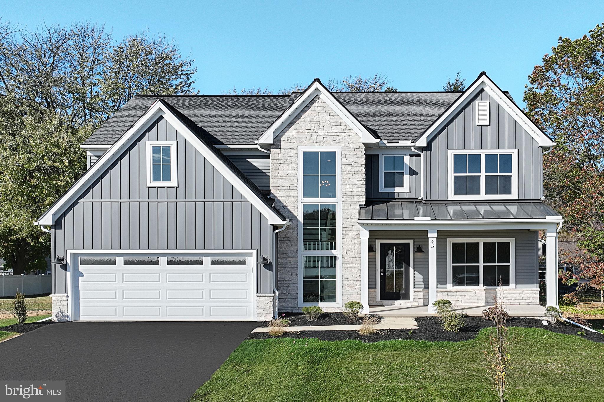 This beautiful home features a welcoming front porch, stylish exterior, and a 2-car garage. The garage opens to a mudroom complete with a large pantry, powder room, and a built-in bench. The first floor boasts durable vinyl plank flooring and 9’ ceilings. To the front of the home is a flex room that can be used as a study, living room, or other versatile space. The kitchen is well-appointed with quartz countertops, a tile backsplash, and enhanced cabinetry and appliances. Adjacent to the kitchen is a sunny dining area with access to the rear composite deck and a comfortable family room warmed by a cozy fireplace. The 2nd floor owner’s suite features an expansive closet and a private bathroom with a tile shower and double bowl vanity. Also on the 2nd floor are 3 additional bedrooms, a full bathroom, and a convenient laundry room. The basement is partially finished with a kitchenette, tv area, recreation area, and bathroom. Sliding glass doors open to a patio.