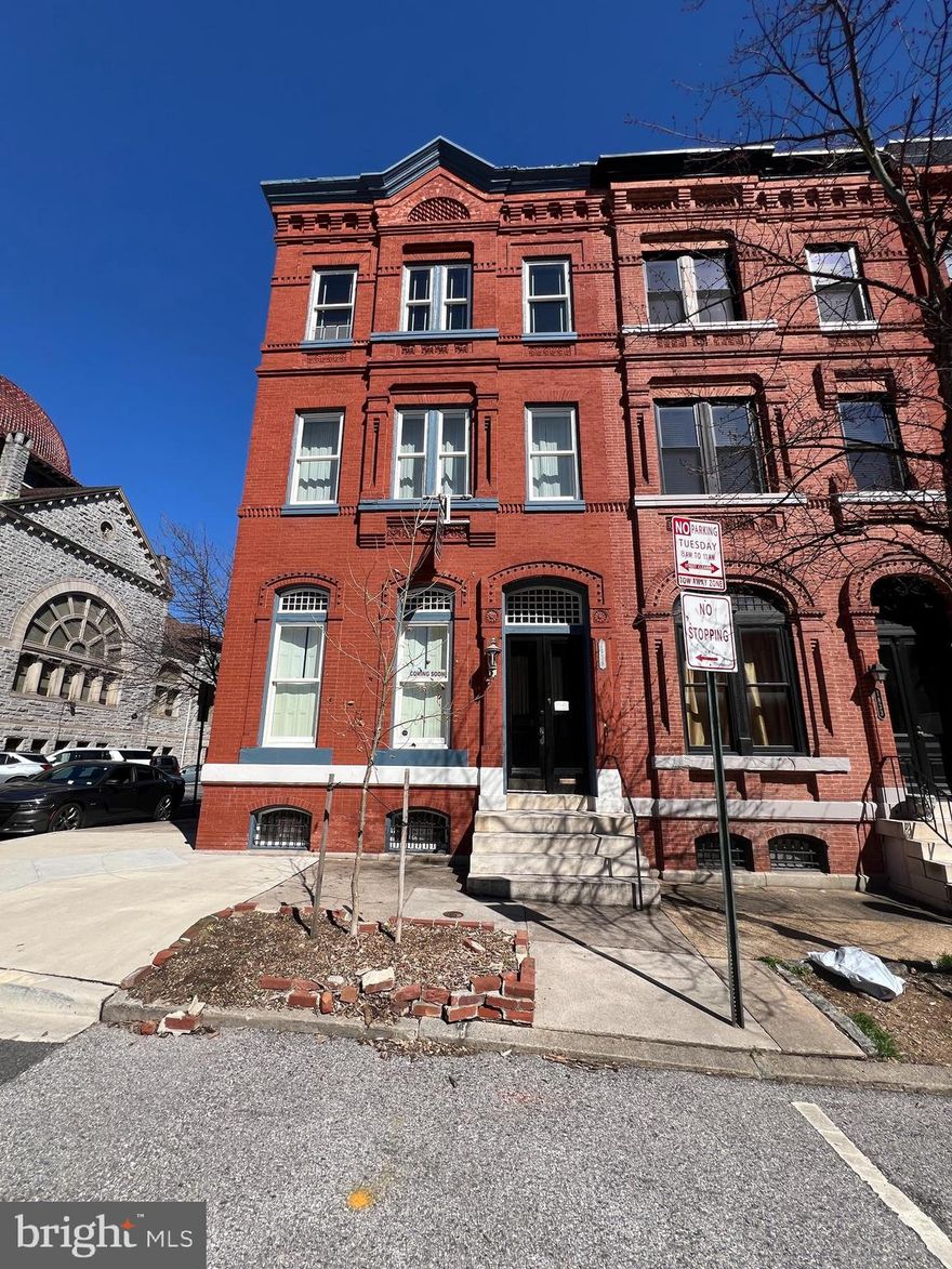 *Listing to be updated with professional photography before 5/9*
SHOWINGS BEGIN WITH THE OPEN HOUSES. PLEASE STOP BY: FRIDAY 5/8 FROM 4-6PM | SATURDAY 5/9 FROM 12-2PM OR 4-6PM | SUNDAY 5/10 FROM 4-6PM. 

AGENTS - PLEASE VIEW AGENT REMARKS IN BRIGHT MLS. Experience the timeless charm of this stunning Madison Park townhome, offering over 2,700 sq ft of elegant living space. Blending classic Victorian details with modern comforts, this beautifully maintained home features parquet floors, 11-foot ceilings, marble mantels, crown molding, and stained-glass windows. Both front and rear staircases add unique architectural interest. 

The open first floor centers on a chef’s galley kitchen with high-end appliances and ample storage, perfect for entertaining. Upstairs, the master suite includes a cozy gas fireplace, en-suite bathroom, and access to a private deck. Three additional bedrooms and two full bathrooms complete the upper levels. 

The partially finished lower level with plumbing roughed in offers potential for a recreation room or home gym. Outside, a secret brick patio and garden provide a peaceful retreat. Additional features include two-zone heating and cooling, and a prime location near public transit, universities, and downtown Baltimore. 

Located in the historic Baltimore City CHAP district, this Madison Park townhome offers a rare blend of historic elegance and modern living in a sought-after neighborhood.

Offers may be entered ONLINE through Friday, May 22, 2026 at 5:00 pm.

AT SELLER'S DISCRETION, AN OFFER MAY BE ACCEPTED AT ANY TIME.