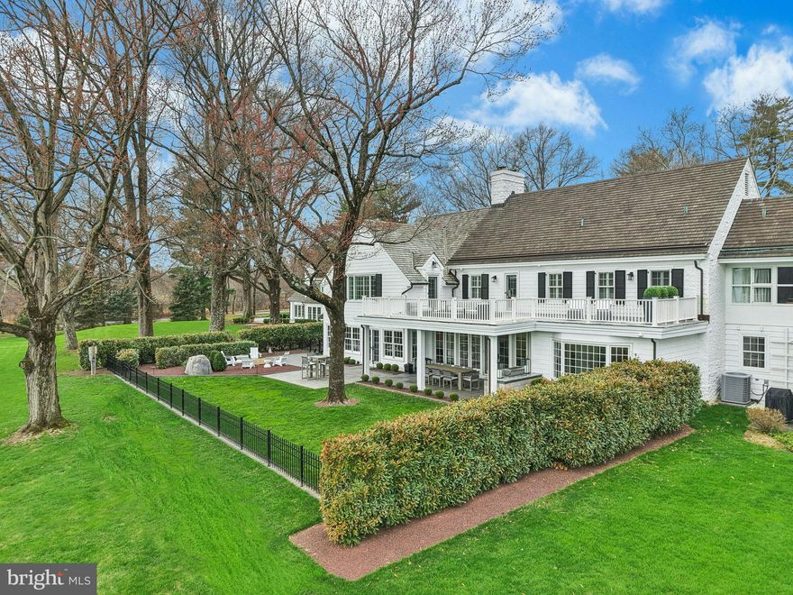 This may be the best home you have ever seen…..On a private road in a world-class neighborhood, surrounded by mature trees and manicured lawn, this exceptional home has panoramic views over 22 acres of meticulously tended grounds, within walking distance to the Weyhill Golf Course of the Saucon Valley Country Club. This noteworthy property, in coveted “Old Weyhill”, is part of an exclusive eight home enclave that is reminiscent of a New England village green.
Weyhill Circle boasts every amenity one would expect, with a newly remodeled and gracious design. Beautifully redone, with sophisticated additions, there are walls of windows in every room to frame the pastoral and protected vistas. Breathtaking at entrance, an expansive coffered-ceilinged living room is sun-filled with a wonderful flow for entertaining, opening to a stunning covered porch and outdoor kitchen, beautifully landscaped with sunset views. Adjacent, the enormous family room, also with coffered ceiling, boasts a bar, second fireplace, built-in bookcases and a south-facing wall with charming window seats.  An extraordinary and expansive kitchen offers high-end appliances, newly opened to an inviting dining room. Throughout, attention to detail is evident in the custom built-ins and bookcases, crown moldings and fabulous windows, with multiple doors beckoning one outside. Hardwood floors enhance every room, on every floor, while an elevator accesses three levels.
The sumptuous, new primary suite will delight and impress.  A generous primary office opens to a cathedral-ceilinged master bedroom with fireplace, walls of windows and full house deck with incredible long-distance vistas. The elegant primary bath, with dressing room and custom walk-in closet, will soothe and pamper.  Three additional bedrooms, laundry and 2 baths complete the second floor.  A wonderful bonus, the third floor offers an additional family room.
On the lower level, a custom designed wine cellar is adjacent to the elevator, for easy access. There is a work area with a quarter bath and 2025 custom cabinetry. A 20 KW generator and HIK Connect technology offer peace of mind. The new, oversized three car garage has a special alcove for your Golf Cart …. available with SVCC approval.
Weyhill Circle invites one to linger and enjoy the beauty of this environment, in a privileged position amidst a 22 acre piece of paradise …. all within the private roads of the Saucon Valley Country Club.  Rarely does a home offer such sophisticated ease of living, in a premiere location, surrounded by an outside environment that invites you, daily, to walk the acreage and private roads.  On the bluestone patio, overlooking bucolic views, the everyday backdrop includes wildlife by day and a brilliant umbrella of stars by night.  Here, worry-free luxurious living exists in a location that rarely becomes available, in a setting that is one of Saucon Valley’s best.
