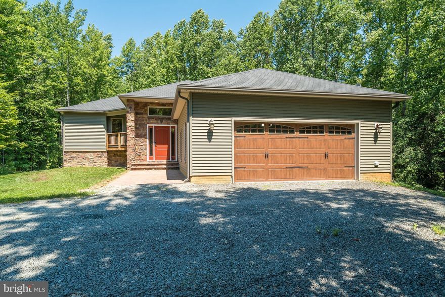 Truly a one of a kind! Privately situated on a mostly wooded 6.4 Acres you will find this unique custom built home. Soaring windows, wrap around deck and secluded screen porch create a sense of living in a treehouse!  Superior construction, high quality finishes, attention to detail throughout. Almost everything has been recently remolded and upgraded! New appliances have WIFI! No fees w/ HOA