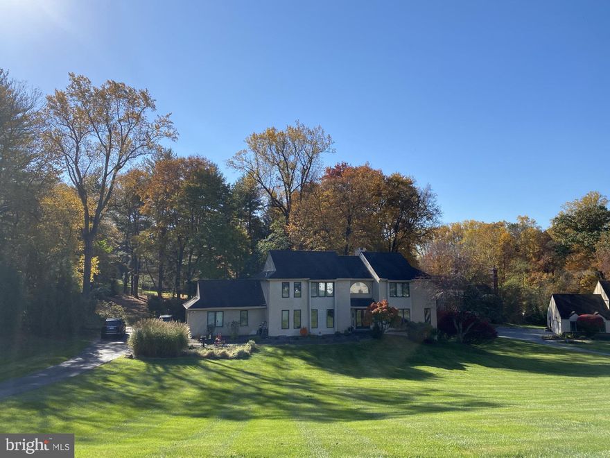 Classic Colonial offers 3,700 square feet of pure luxury! Nestled on a peacefule loop street with minimal through traffic, this home offers a safer setting and is set back from the road for enhanced privacy and seclusion. and Double-door entrance to the two-story foyer, with open floor plan. Formal Living Room and Dining Room on either side of foyer with hardwood floors. Spacious updated kitchen with granite counters, birch cabinets, center island, wide plank hardwood floors, stainless steel appliances, breakfast area with sliders to screened-in porch. Family room with vaulted ceiling, floor-to-ceiling brick fireplace, and wall of windows with peaceful views of back yard. Enter main floor laundry room with storage cabinets and folding counter through pocket door from kitchen, adjacent to inside garage door. Main floor Office Room situated off Living Room and Family Room affords privacy and tranquility. Master Bedroom includes private sitting area with outside deck perfect for morning coffee or after-hours aperitif, walk-in closet, spacious bath with soaking tub, shower stall and double vanity. Three additional bedrooms and hall bath complete the second floor. Walk-out finished lower level includes full bath, work shop and storage. Deck off kitchen and family room. Easy access to RT 476, Philadelphia International Airport, downtown Philadelphia. No HOA fee. Schedule your showing today!