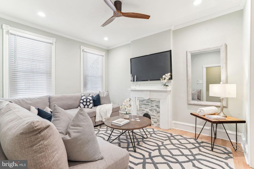 Old meets new….covered front porch and enter into old fashioned vestibule, gorgeous new wood floors throughout, high ceilings, brand new kitchen with a plethora of kitchen cabinets, pot filler, backsplash, pendant lights, dining room, 3 bedrooms, 2 full bathrooms (1 brand new) , and central air, and fenced in back yard.