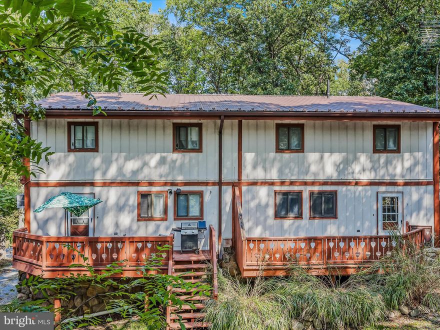 Great investment opportunity! This property features 6 separate units, 5 two bedroom units and 1 one bedroom unit. Presently, 4 units are rented for a total of $3,300 monthly.  Could be used for long term rental or AirBNB. Access to Lake Shannondale is available through membership. Memberships range from daily rate to $350 annually for family membership.  The main and upper levels house apts 1-4, with each being 2 stories. All of the units feature separate decks. Apts 1 and 2 on the front of the property, and 3 and 4 are in the rear. The main level of each unit features a large, open floor plan with living, dining, and kitchen. There is a large utility room for storage. The U shaped kitchen is great for efficiency. Upstairs are 2 large bedrooms with ample closet space. The primary bedroom includes a private balcony with beautiful views. The hall bath features a single bowl vanity and tub/shower. The lower level of the property is made up by Apt 5 and Apt 6. The units share a large patio. Apt 5 is the 1 bedroom unit. It features an open floorplan with large living room and kitchen. Kitchen features ample countertop space, stove and refrigerator. The bedroom features a private ensuite bathroom and large closet. Apt 6 features a huge living room with a built-in drafting desk with surrounding shelves. It is open to the dining room and kitchen. Down the hall are your 2 large bedrooms. The primary features private access to the shared bath. This property has tons of potential uses and great revenue. Schedule your showing today! 

Rental Breakdown
Apt 2 (2 bedroom) = $950
Apt 4 (2 bedroom) = $850
Apt 5 (1 bedroom) = $650
Apt 6 (2 bedroom) = $850