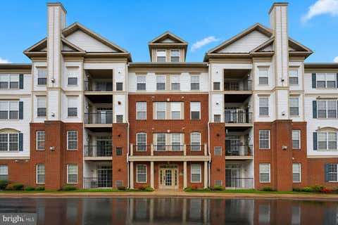 Photo of 11565 Cavalier Landing Court #401, FAIRFAX, VA 22030 (MLS # VAFX2333096)