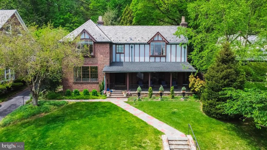 Set atop College Hill, this magnificent brick and tudor house is a one-of-a-kind property. Newly renovated and updated, this property has been pristinely kept. Pool is situated on its own lot; access from the back yard. House sits on .34 acres and add'l pool lot adds .44 acres. Total acreage is .7650. Enter the home through a massive front porch and original oak door into the gorgeous foyer. Freshly painted walls on all levels. New oak flooring in kitchen and laundry/mud room. Living room with cast stone fireplace. Stain-glass doors open to family room with 2nd fireplace. Large windows and southern exposure makes this a bright home. The fully renovated kitchen is complimented by new appliances, soapstone countertops and backsplash. Side door opens to the backyard. Half bath and fully redone laundry/mud. Venture up on the newly added stair runner to the 2nd floor. Master bedroom with walk-in closet, custom built-in cabinets and en-suite bathroom. 3 more spacious bedrooms, lots of natural light, amazing views, new blackout blinds and curtains, and 2 add'l full bathrooms. Fully finished lower level, split into a rec room and workout area, and outside access. Finish this property with a large in-ground pool, newly installed safety fence, cover, filter/pump, new gas line to new pool heater, and dolphin cleaner. The entire property has been professionally landscaped, updated electrical and plumbing, and new exterior lighting, smart house technology, security and camera systems.