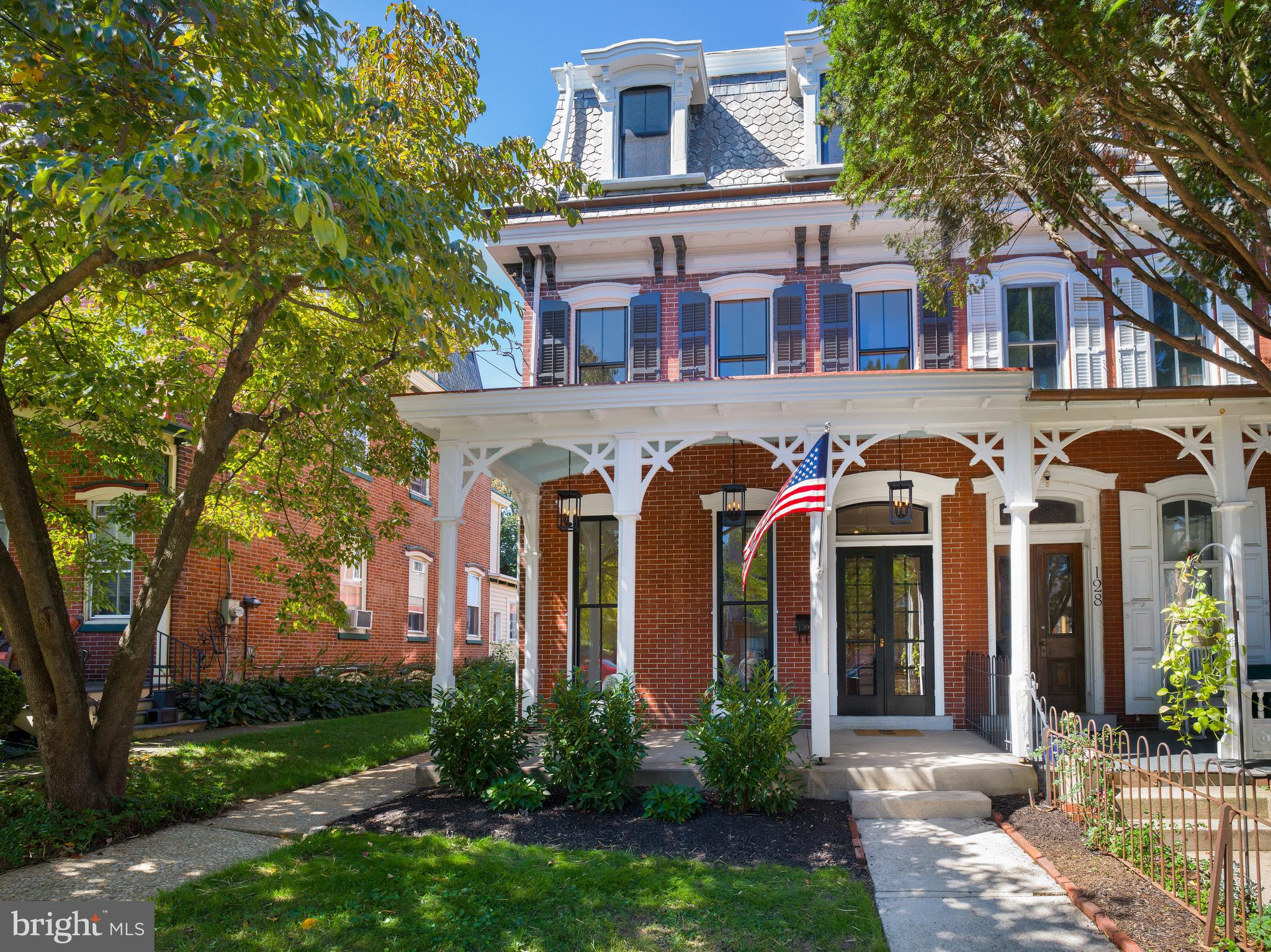 Welcome to 130 Gay Street, where early 1900’s charm meets a top-to-bottom, tastefully executed renovation. Just two blocks from downtown Phoenixville, this elegant brick Victorian shines with its inviting front porch, intricate millwork, and timeless curb appeal. Inside, you’re immediately struck by the abundance of natural light streaming through brand new Pella windows. The first floor’s 10-foot ceilings and the second floor’s 9-foot ceilings create a sense of volume and airiness rarely found in homes of this era. Beautifully restored long-leaf pine floors run throughout, blending seamlessly with crisp white walls, wide trim, and coffered ceilings that celebrate the home’s historic character. The gut renovation was carried out with thoughtful care: all new electric, plumbing, ductwork, and HVAC for peace of mind, yet every detail honors the past. The expansive open living and dining areas feel both grand and welcoming—perfect for gatherings or quiet evenings at home. The chef’s kitchen is a masterpiece of modern design, with custom cabinetry, quartz countertops, a dramatic herringbone backsplash, and high-end stainless appliances. Gold fixtures and statement lighting add just the right touch of sophistication. Beyond, the newly created laundry room offers convenience with custom cabinetry, counters, and front-load washer and dryer. A stylish half bath completes the main level. Upstairs, the primary suite offers a calming retreat with an exposed brick accent, walk-in closet, and a luxurious en-suite bath featuring heated floors, a frameless glass shower, and double vanity. Two additional bedrooms are bathed in light and served by a brand new hallway bath. The third floor unveils a private suite with full bath—perfect for guests, an office, or in-law accommodations. Step outside to enjoy the home’s quiet outdoor spaces: a wraparound porch for neighborhood watching, a side porch tucked away for morning coffee, and a brick patio and garden designed for entertaining under the stars. To top it off, the unfinished basement provides endless flexibility—ideal for storage, a workshop, or future finishing. Every inch of this home has been renewed with modern amenities while preserving the craftsmanship and charm of its historic roots. 4 bedrooms, 3.5 bathrooms, sunlit interiors, soaring ceilings, and flexible living—all within walking distance to downtown Phoenixville.