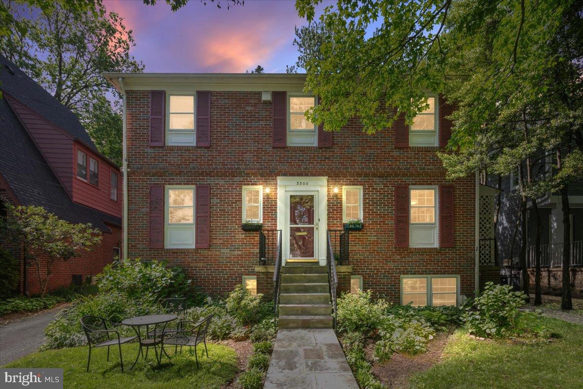 Discover this charming colonial-style brick home at 3500 Shepherd Street, ideally located on a desirable, tree-lined street in the heart of Chevy Chase. What truly sets this property apart is the highly versatile, attached apartment, offering unparalleled flexibility and significant value. This self-contained unit is perfectly designed to serve multiple purposes: Rental Income-Generate steady income with a highly desirable, independent rental unit; Multi-Generational Living-Provide a comfortable and private space for extended family; Au Pair / Caregiver Suite-An ideal arrangement for live-in support; Private Guest Retreat-Offer visitors their own dedicated amenities; Executive Home Office-A professional and separate workspace. This bright apartment features its own kitchen with quartz countertops, new carpet throughout, a charming built-in bookcase, a sunny bay window, and a full accessible bathroom. The spacious bedroom includes a large closet. For complete independence, it comes with an in-unit washer and dryer, a separate entrance, its own electric panel, and a dedicated attic space for storage. The apartment is seamlessly connected to the main home by a light-filled entrance with a skylight, blending convenience with privacy. The main residence features three bedrooms and three full bathrooms. Its traditional layout showcases beautiful, refinished hardwood floors, a formal dining room, and a full kitchen equipped with granite countertops, stainless steel appliances, and a convenient outside entrance. The comfortable living room includes a cozy wood-burning fireplace, and a versatile first-floor room offers flexibility as a bedroom, home office, or den. Upstairs, you'll find three bedrooms, including a primary suite with an en suite bathroom and walk-in shower. A full guest bathroom provides a tub/shower combination. Adding significant living space is the fully finished walk-out basement. This lower level provides a full bath, utility/storage room, and three separate rooms ideal for recreation, a home office, a gym, or guest quarters. The spacious rec room, with a wood-burning fireplace, is perfect for entertaining. The walk-out offers easy access to the sizable, partially fenced backyard, creating a wonderful setting for outdoor enjoyment. Its prime location offers easy access to vibrant downtown Bethesda, the shops and restaurants of Friendship Heights and Chevy Chase. Don't miss this opportunity to own a truly special Chevy Chase gem!