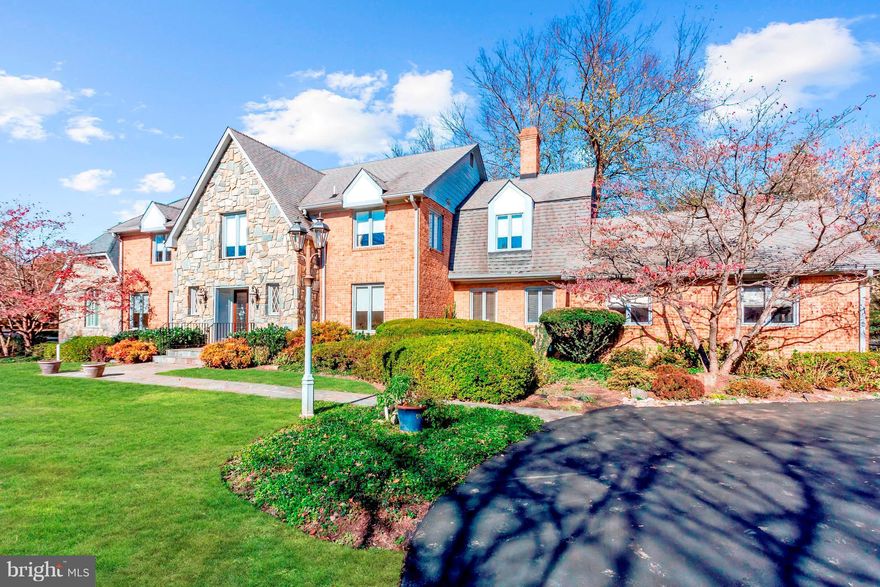 Beautifully maintained custom built home on picturesque 2+ acre lot, accentuated with lush greenery and beautiful landscaping providing superb grounds for everyday enjoyment. The inviting open floor plan is perfect for living and entertaining.  The First floor Master Suite w/cathedral ceiling, features a fabulous Master Bath and wonderful closet space. A Great Room addition w/vaulted ceilings exits  to a deck. Enjoy the screened-in Porch for lovely summer nights. The renovated Gourmet Kitchen with center island and quality appliances is adjacent to the inviting Family Room w/fireplace.  The Library/home office has custom built-ins. The second Master Bedroom Suite on the second floor has large walk-in closets and a beautifully renovated Master Bath.  There are 4 additional large Bedrooms and 2 more Baths on the second Floor.  The lower level has fantastic space for play and casual gatherings, a wine tasting area, full bath and  an abundance of storage. A potential 4th car garage has been added few years ago.   ......This home and its setting feels like a vacation year round.....