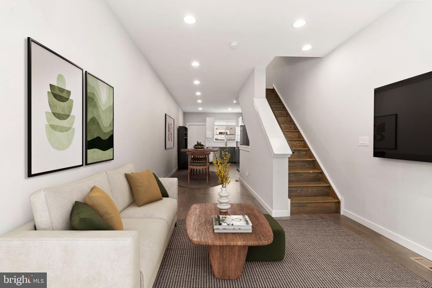 Experience modern sophistication at 1907 E Harold Street, a newly built (2023) 3-bedroom, 2.5-bathroom home in the heart of East Kensington with approximately 8 years remaining on the tax abatement. Designed with both style and functionality in mind, this home features wide-plank flooring and oversized windows, filling the space with natural light. With open concept living, the spacious living and dining area seamlessly flow into the kitchen, offering stainless steel appliances, a designer tile backsplash, and custom white cabinetry for ample storage. Off the kitchen is a lovely back patio with bonus storage shed. Upstairs you'll find convenient 2nd floor laundry and a full hall bath. Two spacious bedrooms, one featuring custom remote controlled blinds, complete this level. The third-floor primary suite is a private retreat, complete with a wet bar, spa-like ensuite with dual sinks, and an oversized glass-enclosed shower. Need extra space? The fully finished basement is perfect for a home office, gym, or additional living area, complete with a convenient half bath. The crown jewel of this home is a rooftop deck with panoramic skyline views, ideal for entertaining or relaxing. Conveniently located in close proximity to East Kensington's neighborhood hotspots such as Little Walters, Forin Cafe, Picnic, Zig Zag BBQ, & Philadelphia Brewing Company, this home delivers the perfect blend of modern design and urban convenience.