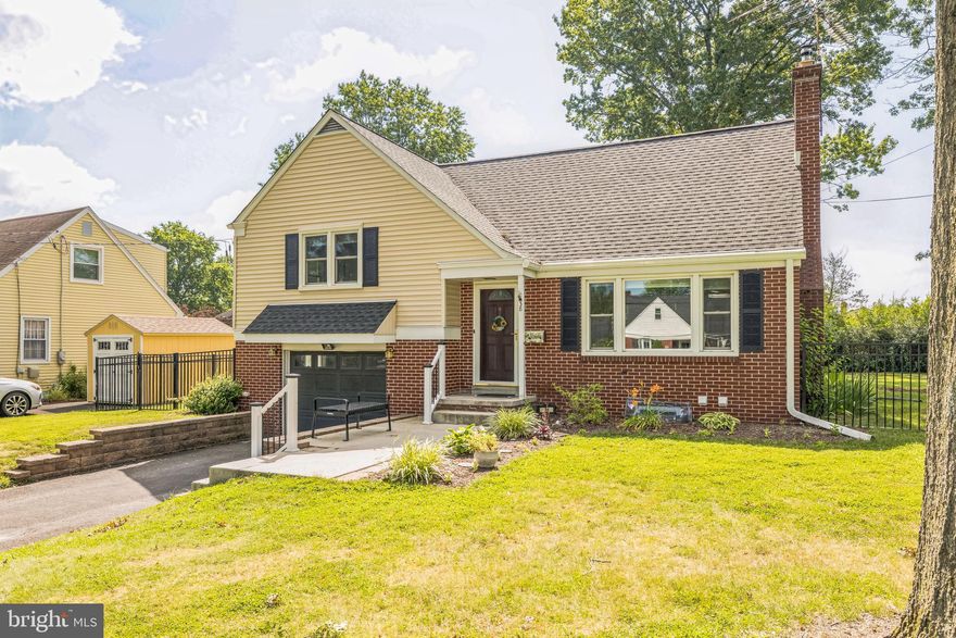 PRICE REDUCTION!  Welcome home to this meticulously maintained split in the heart of Telford Borough!  Charming in every respect as you enjoy the beautiful weather on the front porch bench or step into the large living area, with wood burning stove, open kitchen and dining area.  Next to the kitchen is an additional space that you can use as a family room, office or playroom with full size bathroom.  From here, you can access the beautiful wooden deck to enjoy your morning coffee or entertain your friends.  A few steps off the living room are the 3 large bedrooms and 2 more full baths.  Head downstairs from the living room and you will find a large laundry room with exit to the large fenced in yard, the attached garage and partially finished basement.  Hardwood floors throughout!  The rooms are endless!  This home has been lovingly cared for with a brand new roof in 2024!  Some photos have been photoshopped to give you an idea of how beautiful you can make it your own!  Located in Souderton School District, this home will not last long!