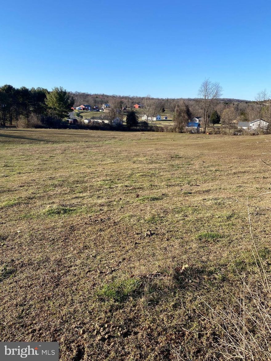 Beautiful 2.12 Acres of raw unrestricted Land in Hedgesville, WV.  This is a nice level lot in a rural setting away from the hustle and bustle but close enough to amenities.  Just perfect for building your dream home.    There is an additional 2.07 acre adjoining lot that is also available, see MLS#  WVBE2027114.  Call for more information today!