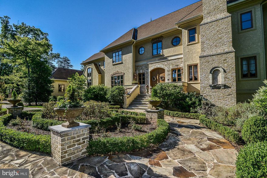 Langley School tier! Why wait for new construction? Move right in & enjoy this barely lived in 13,000+ fin. sq.ft home, selected as Habersham Furniture showcase home & built by Award Winning Chesapeake Construction Co. Every room exudes luxury and quality! Grand entry  breath taking views of 2 acre pond  main level & upper level master suites au pair suite  chef's kit multiple entertaining areas