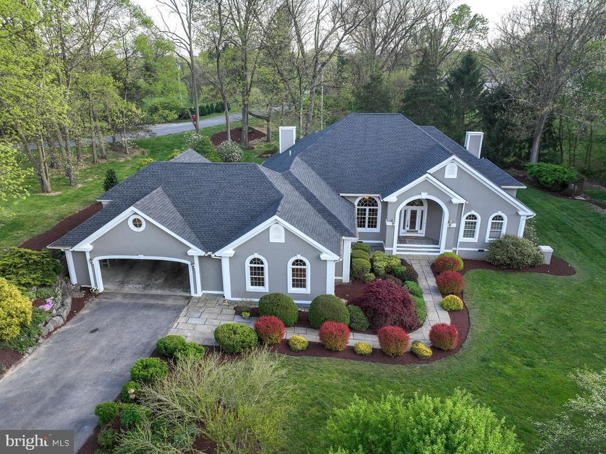 An exceptional luxury offering in the  highly sought after Cress Creek neighborhood of Shepherdstown, WV   
Architecturally stunning, spacious, and well-maintained 5 bdrm, 4 1/2 bath home on a professionally landscaped 3/4 acre,  featuring mature hardwood and pine trees. Large stone formations throughout the yard are used to define garden areas that feature Virginia Bluebells, ferns and fuchsia, among other plantings. An in-ground water feature with a pond, waterfall, and Japanese Maple add to the beauty and peace of the rear yard.  The driveway is surrounded  by a gorgeous rock, flower and shrub garden and stone retaining wall.  

A beautiful wide custom laid front slate walkway, well designed pathway plantings  & handsome covered front porch entrance present a refined welcoming elegance.  

Entering thru a tall,  lovely beveled & stained glass front door with glass side panels  reveals the  grand high ceilinged foyer & open concept formal living room and dining areas, w/ designer  columns, high end tray ceilings, recessed lighting, ceiling fans and lustrous warm solid oak flooring,  flooded w natural light thru elegant Palladian windows, double glass doors to the many back yard entertaining areas, including  covered, custom laid tile patio,  an enormous open 2 level wood deck w bench seating, a large vaulted ceiling gazebo, an intimate  pergola covered by hydrangea, and a sweet relaxing  area of laid brick near the sounds of the gentle waterfall, surrounded by attractive river stones. 

To the right of the entrance, the main level features a separate wing for the guest bath,  w/ French doors into large library/office space w custom built in wood cabinetry, shelving, desk countertops along two walls, and  the fabulous large  primary bedroom suite, w/ensuite spa bath,  walk in custom tiled shower, three huge  wall mirrors, two sinks w wide vanity countertops and cabinetry, a walk in closet and extra bdrm lounge area w/ Palladian windows and doors to the back patio/decks.
Left of the foyer, a hallway leads to two more bedrooms,  each with full baths of their own.  The formal living room leads into an open concept high ceilinged kitchen & family room w its casual eating area, a wonderful propane fireplace, recessed lighting, tall Palladian windows and doors to the back decks. The open kitchen has two pantries, artisanal lighting, dedicated beverage area and glass front storage cabinets, center island w/storage beneath, granite counters & custom tile back splash, double stainless sink, plus an abundance of attractive storage cabinetry.   
On the upper  level the second large  primary bedroom and en suite bath offer vaulted ceilings, two large closets and a smaller adjoining bonus room for  yoga, play space, storage or private relaxation.

An attached oversized double car carport w arched entrances offers work bench space,  large walk in  storage/equipment room  and an interior side entrance to the mud room, hallway, two ample storage closets w pocket doors, and separate  laundry room w  its built in cabinets, shelving, sink and counters.  The hallway here also leads to a private fourth bedroom with its own entrance  to the garage area.  This  home has so many extra storage spaces, a thoughtful floor plan and aesthetically pleasing architectural details. 
The well known Cress Creek country club is a benefit for home owners.

This distinctive Cress Creek property is a sanctuary for the senses and a rarely available offering close to historic Shepherdstown,  Shepherd University, the renowned C&O canal trail and river recreation,  Harpers Ferry Natl Park, and all services.