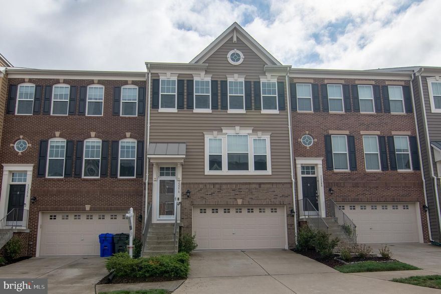 Property is vacant.  Freshly painted three level interior townhome with three bedrooms, three full baths and a half bath on the main floor in Belmont Run. Home includes a finished basement that walks out to a patio and fenced back yard and sod that was installed in 2024. The home backs to trees and also includes a two-car garage and is located in one of the top school districts in Ashburn.  The master bedroom is complete with a ceiling fan, crown molding and two walk-in closets and has an attached master bathroom with double sinks, granite counter tops and ceramic tile floor, and a soaking tub and walk-in shower.  Another full bath with a tub-shower combo is just down the hall with a granite counter top vanity and ceramic tile.  For convenience, the washer and dryer are located on the top floor saving you from carrying clothes up and down the stairs. There are an additional two bedrooms each with ceiling fans.  The main level boasts engineered hardwood floors, a huge kitchen island with granite counter tops, pendant lights, SS appliances and plenty of counter and cabinet space.  The dining room is spacious enough for a large table, or a table and sitting area.  It leads to a Trex deck with vinyl wrapped railings for easy maintenance.  On the other side of the kitchen toward the front of the home is the living room with three large windows allowing for plenty of natural light.  The finished basement recreation room includes a third full bath with a walk-in shower, tile floor and a granite counter vanity.  The basement walk-out leads to a brick style patio and an enclosed fenced-in back yard. There are two built-in closets for additional storage  in the recreation room.  Inside the garage to the left of the utility closet with the HVAC and HWH is another storage area located under the steps making use of unused space.  The home is located just minutes from Brambleton Town Center, where you’ll find an array of restaurants, shops, and entertainment. Only 2 miles from Ashburn Metro with a direct commuter bus. Convenient access to Dulles International Airport and commuter roads. Enjoy nearby Beaverdam Reservoir hiking trails, W&OD bike trail, and the brand-new Hal & Berni Hanson Regional Park. Open house scheduled for Saturday 19 April 1pm - 4pm.