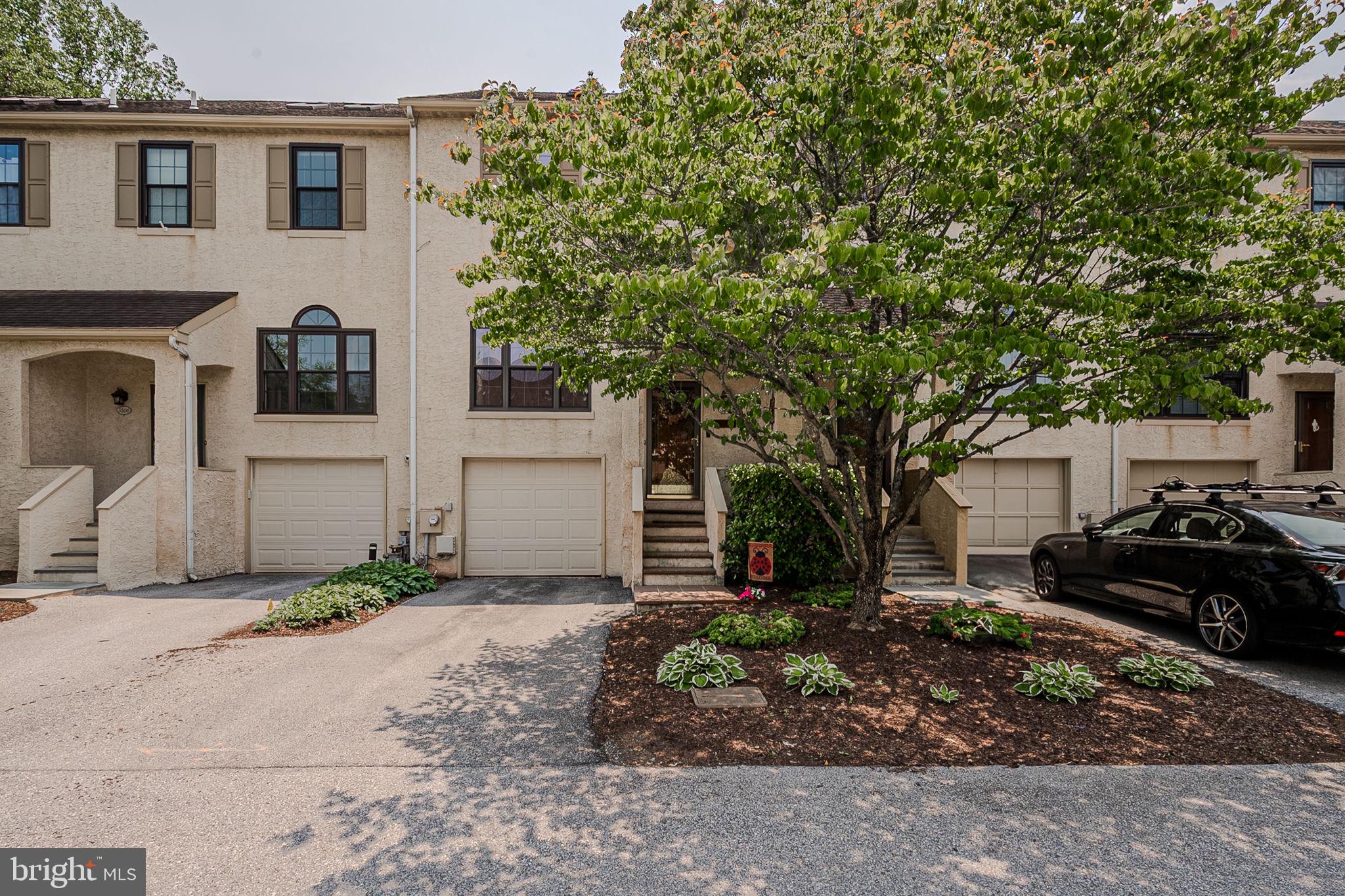 Welcome to 3305 Keswick Way, a well-maintained 3-bedroom, 2.5-bath townhome in the sought-after community of Willistown Woods. This spacious home offers a functional layout, tasteful updates, and thoughtful features throughout.
As you enter, head upstairs to the thoughtfully designed kitchen, offering generous counter space, ample cabinetry, a tile backsplash, and a layout that supports both everyday cooking and entertaining. Just beyond, the dining area features beautiful hardwood flooring, built-in shelving, and a double-sided wood-burning fireplace that also serves the adjoining living room—creating a warm and connected atmosphere.
Continue into the living room, where you’ll find recessed lighting, additional built-in shelving, and an elegant wooden mantel framing the fireplace. Sliding glass doors open to a nicely finished paver patio—perfect for enjoying a morning coffee, casual dining, or time outdoors. A conveniently located half bath completes the main living level.
Upstairs, the owner’s suite includes two closets and a private en-suite bath with a double vanity. A second bedroom and an additional full bath complete this level. The third floor offers a freshly updated bedroom with brand-new carpeting and paint, ideal for guests, a home office, or flex space.
As you descend from the main entrance, you're welcomed into a tiled lower-level hallway with access to the garage and workshop area—featuring an arched doorway, textured walls, and convenient storage. The front-facing garage provides private off-street parking, additional storage, and easy interior access—adding both convenience and functionality to the home.
All of this is located just minutes from vibrant downtown West Chester, with easy access to shopping, dining, parks, and regional rail stations. Paoli Station is just a short drive away, offering direct service to Center City Philadelphia—making commuting a breeze. Enjoy the charm of Chester County living with convenient access to major routes, top-rated schools, and sought-after outdoor spaces.