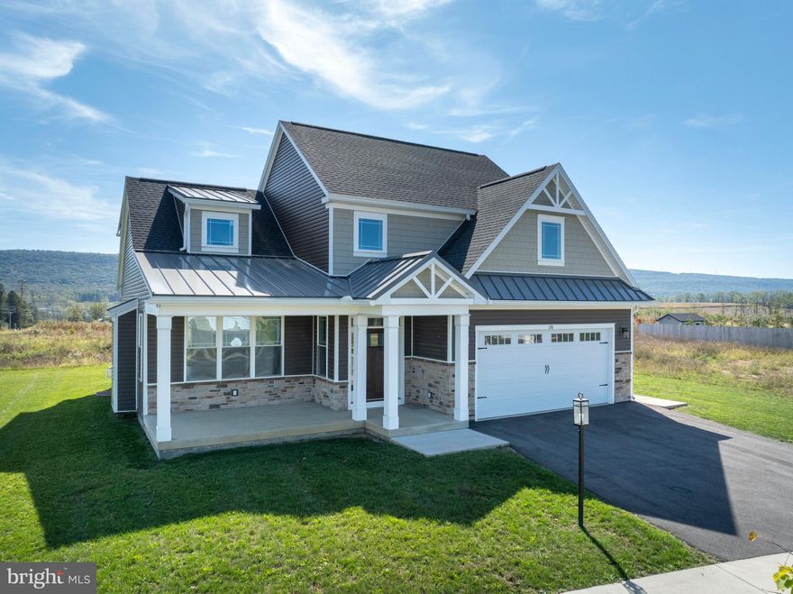 This stunning brand-new 4-bedroom, 3.5-bath home offers 2,436 sq. ft. of refined, modern living in the Orchard View community. The sleek kitchen is both stylish and functional, featuring quartz countertops, a large island, stainless steel appliances, and a walk-in pantry. It opens to a vaulted family room with a gas fireplace and expansive windows that frame breathtaking mountain views. The main-level owner’s suite impresses with hardwood floors, a tray ceiling, walk-in closet, and spa-like bath with dual quartz vanity and tiled shower. Upstairs includes three spacious bedrooms, two full baths, a versatile loft, and a convenient laundry room. Hardwood flooring and contemporary finishes create a bright, polished feel throughout. A daylight basement with rough plumbing offers a head start for future living space. Beautifully finished and move-in ready, this home captures modern design, comfort, and scenic surroundings all in one.