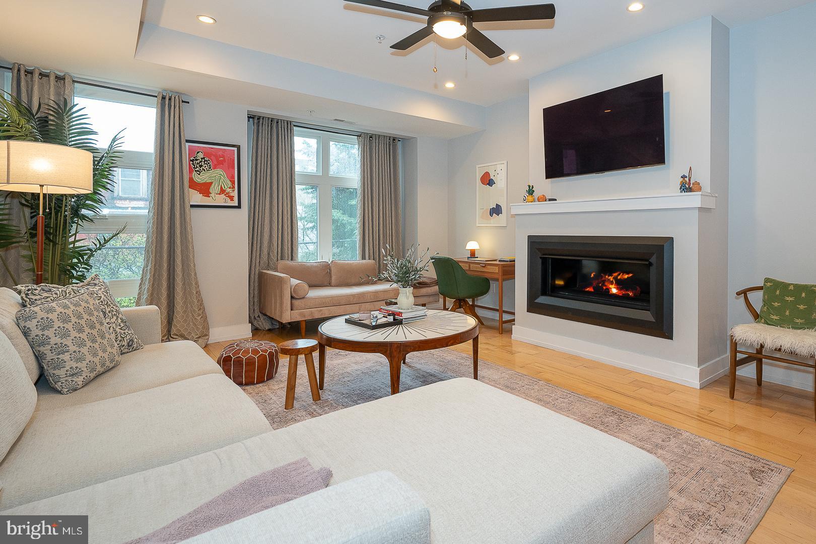 Step into this sun-soaked, 3-bedroom, 3-full-bath gem offering four levels of stylish, functional living. The entry level welcomes you with a wide hallway, coat closet, interior garage access, a spacious bedroom, full bath with soaking tub, and a beautiful fenced in private garden with patio—perfect for quiet outdoor moments.
Upstairs, the open-concept main floor impresses with expansive windows, a cozy fireplace, and generous space for entertaining. The L-shaped kitchen is designed for both form and function, featuring stainless steel appliances, granite countertops, ample cabinetry, and a breakfast bar. The dining area is spacious and light filled great for entertaining.
The third level hosts the serene primary suite with two closets, oversized windows, and a Juliet balcony. The primary en-suite bath is spa like and includes dual sinks and a glass-enclosed shower. The Laundry Room with full sized Washer and Dryer are conveniently located next to the Primary Suite. A third bedroom and another full bath with a soaking tub/shower combo complete this floor.
Top it all off with a rooftop oasis: a large deck with sweeping Philadelphia skyline views and a built-in wet bar with a wine fridge in the pilot house—ideal for entertaining. The lower level offers a versatile tiled bonus family room and additional storage space. There is a newer 20 yr roof with transferable warranty.
All this, just steps from public transit, beloved restaurants, shops, cafés, Liberty Lands Park, and a community dog run. This is urban living at its best—don’t miss your chance to make it yours!