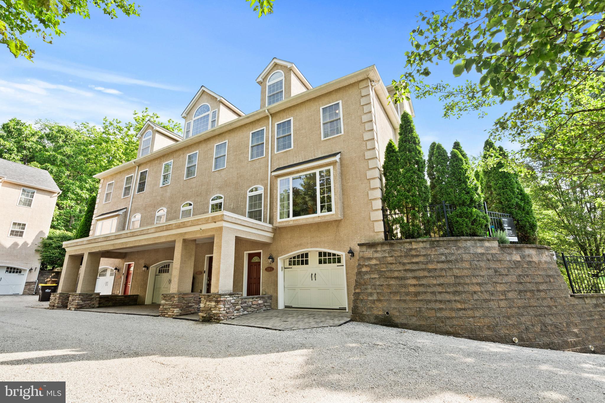 Welcome to 338 Ross Road – a hidden gem in King of Prussia. Look for the speed bump to find the driveway, then veer left at the split and you’ll be surprised to find this 4 bedroom / 4.5 bath end unit townhome, part of a 4-home community tucked away at the top of the hill. Located just across the street from Ross Road Park and a 5-minute drive or 30 minute walk to shopping, the Upper Merion Library, parks, and community schools, this home feels secluded amongst the property’s towering trees but is conveniently close to everything you need.
Built in 2007, this home has been well maintained and updated by the current owners. Cook a meal and care for family with newer appliances, organize wardrobes in the custom closets, and enjoy a comfortable climate year-round from two new HVAC systems with programmable thermostats and additional insulation in the dormers. Never run out of hot water with the tankless heater as you bathe in one of the 4 showers or tubs.
Enjoy the open floor plan of the kitchen, dining, and living space, then step out to the renovated patio where the mature cedar trees create a private oasis. Bedrooms upstairs offer plenty of storage and natural light, each with an ensuite bathroom. Laundry is conveniently located on the second floor, making chores that much easier. The bedroom on the ground floor offers private entry through the garage as well as another ensuite bathroom.
The self-managed 4-home HOA covers all lawn care, including flea and tick prevention, and snow removal, allowing for low-maintenance living year-round.
Don’t miss the opportunity to own this move-in-ready home in one of King of Prussia’s most unique and private settings. Schedule your tour today!