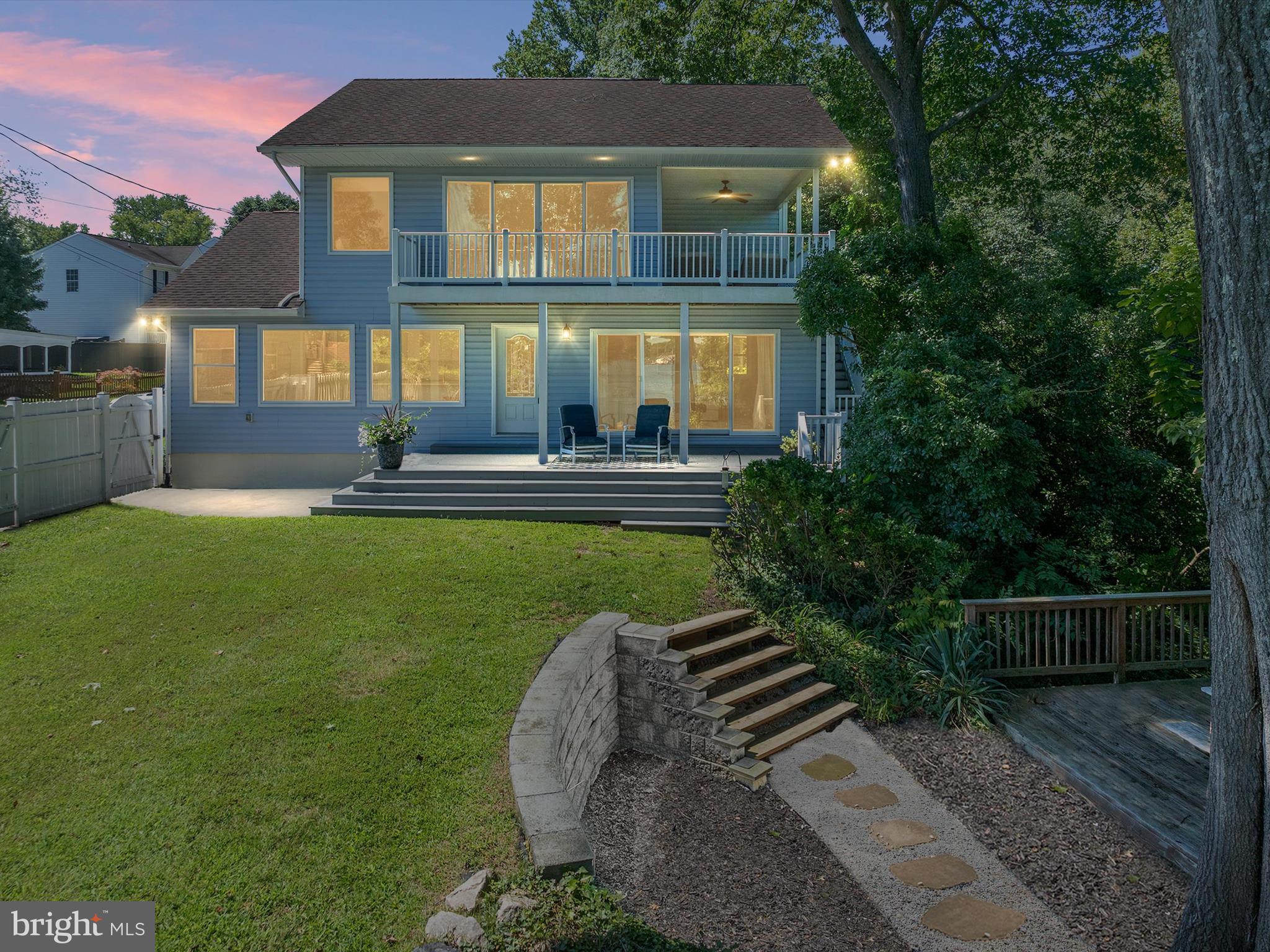 PRIVATE WATERFRONT! Enjoy breathtaking sunrises from this east-facing waterfront home on Cool Spring Cove, just off the Magothy River. Completely rebuilt in 2008 and beautifully remodeled with modern touches in 2022, this home is tucked away on a quiet dead-end street with its own private pier and deep-water slip. Privacy meets picturesque views in this stunning setting.
Inside, the primary suite is a true retreat with sunrise water views, a spa-like soaking tub, glass shower and a newly renovated drool-worthy closet you’ll fall in love with. Take in your morning coffee right off the primary suite on your wrap around upper deck & covered porch area. The updated kitchen features gorgeous white quartz countertops, custom built-in bench seating, and modern finishes. Bathrooms have been remodeled, every light fixture has been replaced, and the entire home has been updated. Water has also been run to the dock for added convenience.
The fully finished lower level offers two spacious bedrooms, a full bathroom, and a comfortable sitting area—making this a true 4-bedroom, 3-bath home with flexible living space.
Step outside to your private pier with an additional sun deck and room for two boats. With deep water access and cove protection, you can bring the boat of your choice. Enjoy quick access to the Magothy River and Chesapeake Bay, making this location ideal for boating enthusiasts.
Perfect as a year-round residence, vacation getaway, or income-producing rental—this home is ready for you to start making memories. Schedule your private tour today!
