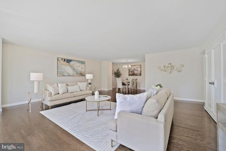 Step into this expansive condo at Tower Villas, where generous room sizes and thoughtful updates set it apart. With over 1,110 square feet of living space, this home offers the comfort and scale rarely found in condo living.

The brand-new hardwood floors and fresh paint create a warm, modern feel throughout. The oversized living room—an impressive 21' x 20'—features a wall of glass that floods the space with natural light and opens to a private terrace with tranquil tree and park views along 9th Street. The layout flows seamlessly into a formal dining area, ideally positioned just off the kitchen.

The kitchen is both stylish and functional, equipped with stainless steel appliances and gray Corian countertops. The large, south-facing bedroom (14' x 16') boasts abundant closet space and easy access to the full bathroom just outside the door. You'll also appreciate the full-size laundry room with ample storage and a stacked washer and dryer.

One dedicated garage parking space P2-7 is included.

Tower Villas offers exceptional amenities, including a 24-hour concierge, outdoor pool, and fitness center. Enjoy unbeatable convenience just two blocks from Virginia Square Metro, four blocks from Ballston Metro, and moments from Ballston Quarter's vibrant shops and dining.