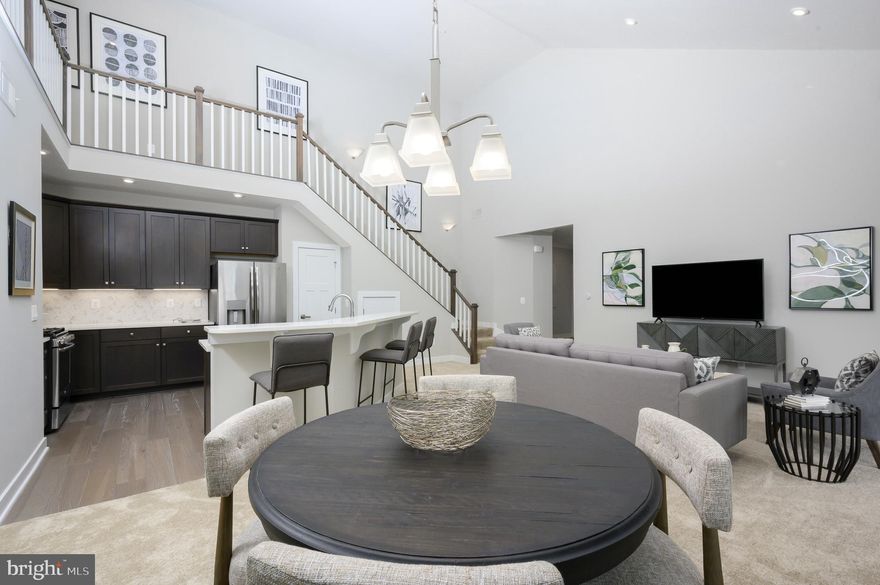 Welcome to Urbana's only EXCLUSIVE 55+ active adult elevator condo's community!  This Chambord with loft at the Woodlands by Ryan Homes.  As soon as you enter the foyer of Ryan Homes Chambord, you will see how luxury and convenience can converge to create the home you need in the space you want. A large coat closet and storage area give you plenty of space to stow your things. As you walk in, the light and airy Great Room greets you with a bank of windows through the Sunroom, and a sliding glass door to your private balcony or patio. Do not forget to add the optional fireplace to make your space even cozier! Open to the Great Room over a convenient breakfast bar, the Kitchen features plenty of counter and cabinet space and a large pantry. The Owner's Bedroom features two large closets (one of which is a walk-in!). The owner's bath has a double bowl vanity and offers either a tub or shower with seat. Through the foyer is another full bath, laundry area and second bedroom which also boasts a huge closet. With a front, upper level unit, the second bedroom comes with a flex space area, perfect for office or playroom. The top floor unit comes with a loft for even more living space and grand views of the great room. No matter which options you choose, the Chambord is a flexible floorplan that you will love to call home. Other floor plans and homesites are available. Photos are representative.