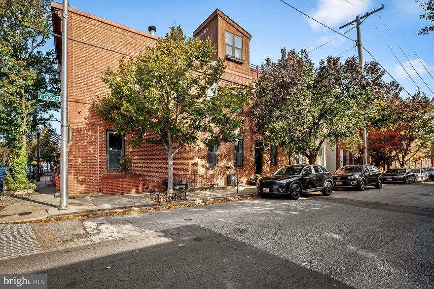Live & Earn Income! This awesome Federal Hill corner lot home offers 3 bedrooms, 2.5 baths PLUS a  separate basement apartment with 1 bedroom, 1 bath, large living area and full kitchen/dining - ideal for rental income- long term tenant or Airbnb!

Situated in a coveted location a couple blocks off of the water and Federal Hill park, the main level welcomes you with impressive high ceilings that create an expansive space on the first floor. There's an oversized living room with wood floors and wood burning fireplace and a versatile elevated seating nook that would be great as an office space, library, or gaming area. There's a separate dining room with the classic Baltimore brick walls and a pass through to the kitchen. The kitchen has white cabinets, granite countertops and a built in breakfast nook with bench. Tucked off the kitchen is a walk in pantry and half bathroom- a treat in a city rowhome!

Upstairs, you'll find an additional flex space with built in desk and shelving- perfect for another work space. The primary bedroom suite features a spacious walk-in closet and an en-suite bathroom with lots of natural light. There are two more light-filled bedrooms on this floor with hardwood floors, a decorative fireplace and large windows. From the upper hallway, ascend the spiral staircase to your private rooftop deck with awesome water and city views. Perfect views for fireworks!

Location couldn't be better - walking distance to the Inner Harbor, Cross Street Market, diverse dining options, vibrant nightlife, both stadiums, plus easy highway access to I-95 and I-695.

3 ways to own!
-buy as an investment, rent out both and cash flow monthly
- live upstairs and rent out the basement (long term for Airbnb) for extra income
- live downstairs and rent out upstairs which would cover much of the mortgage