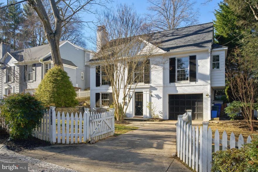 Prepare yourself for a nice surprise. This home is much larger than it appears. It features four seriously spacious bedrooms, two of them with en suite baths. The main level has a large living room with a wood burning fireplace and floor-to-ceiling Georgian windows which flood the space with light. The dining room has french doors opening to a stone patio. It also connects to the large, eat-in kitchen with a gas range and ample storage space. The family room off of the kitchen has a wood-burning stove, patio access and a private deck on the other side.  Built-in bookshelves and a large picture window complete the room and make it the perfect gathering spot for your next Superbowl party! Also on this floor is a large bedroom with its own full bath. The upper level has three more bedrooms, a hall bath, and a primary bathroom.  All of the rooms have generous closet space, and there is some under-the-eaves storage to be had, as well. The lower level features the main entryway, a bright, carpeted family/library room with more built-in shelves and a second fireplace; a laundry/utility room, a half bath, a storage room, and access to the one-car garage.  Outside you'll find mature plantings, a stone patio, pathways and a grassy back yard that's perfect for future croquet tournaments.  The roof is two years old, the water heater is 1 year old (a baby!).  And there is fresh paint throughout. The house is steps from the Potomac Palisades Conservation Park Trail which leads you past the Waldorf School. Also near is a legendary sledding hill and the Mohican Swim Club (in boundary). The house is located where Wissioming and Waukesha meet, giving it a bit of a cul-de-sac vibe.  Wood Acres/Pyle Whitman schools.
