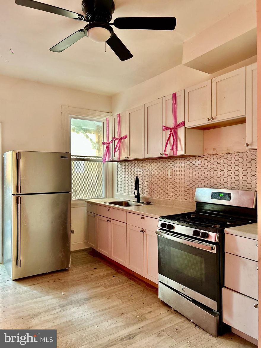 Welcome to this charming brick-front rowhome featuring a classic bay-front design that brings in tons of natural light. Whether you’re a savvy investor looking to add to your portfolio or a first-time homebuyer, this property offers incredible potential at an affordable price point.

 Open-concept main level with spacious living and dining areas, high ceilings and half bath. The layout flows seamlessly into a generously sized kitchen with ample cabinet space, modern backsplash and is ready for your finishing touches. Upstairs, you’ll find comfortable bedrooms filled with natural light, while the full bathroom offers a functional layout with room for cosmetic updates to truly make it your own. 

With just a little TLC, this home can be transformed into a beautiful primary residence or a strong rental investment. Perfect for buyers looking to customize their space or investors seeking their next project