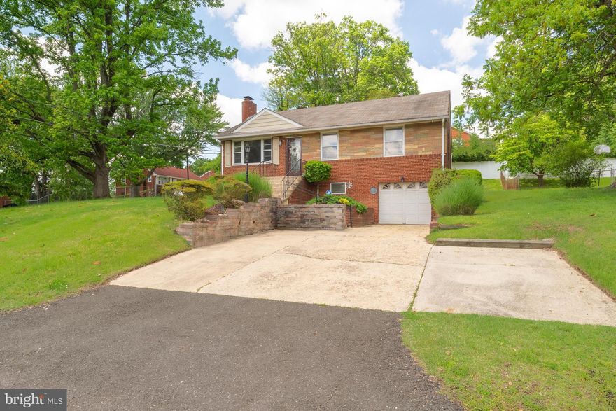 Step into this beautifully maintained home where pride of ownership radiates throughout. From the moment you enter, you're welcomed by rich, timeless hardwood floors that add warmth and character to the main level. The layout features three generously sized bedrooms and two full bathrooms, including a serene primary suite with a private ensuite bath.

The kitchen has been tastefully updated and includes a cozy breakfast nook—perfect for your morning coffee. A separate dining area opens to the spacious deck and private backyard through sliding glass doors, offering a seamless indoor-outdoor lifestyle.

Downstairs, the fully finished lower level is designed for comfort and flexibility, featuring elegant porcelain tile floors, a spacious family room ideal for movie nights, an open flex space with a bar, a third full bathroom, a laundry area, and abundant storage.

The property also offers a deep one-car garage with space for storage, plus a wide concrete driveway that fits up to five additional vehicles. This home offers the perfect balance of charm, comfort, and functionality—move-in ready and waiting to welcome you home. Ideally located near major commuter routes, shopping centers, dining options, and just minutes to National Harbor and Joint Base Andrews—convenience is at your doorstep!