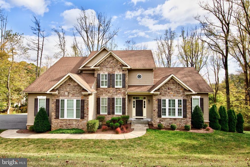 This is the home you have been waiting for*Make your appointment today to see this immaculate custom built colonial in the sought after community of Vine Hill Estates*Featuring main level master suite with luxury garden bathroom, main level office, 2 story family room with gas fireplace, gourmet kitchen with all appliances, amazing sunroom, 2 upper level bedrooms, spacious loft that could be converted to additional bedroom & 2 car side load garage*Full basement has already been framed and drywall is complete for a recreation room with wood stove, full bathroom & extra bedroom*Located on a breathtaking .95 acre lot backing to trees*This home is loaded with the finest amenities and upgrades to include hardwood floors, custom moldings, huge walk in closets, 2 level trex deck, patio, natural gas heat, public water & sewer & so much more*Over 3700 sq ft of living space on the 2 main levels*No HOA fees*THIS HOME IS A 10+