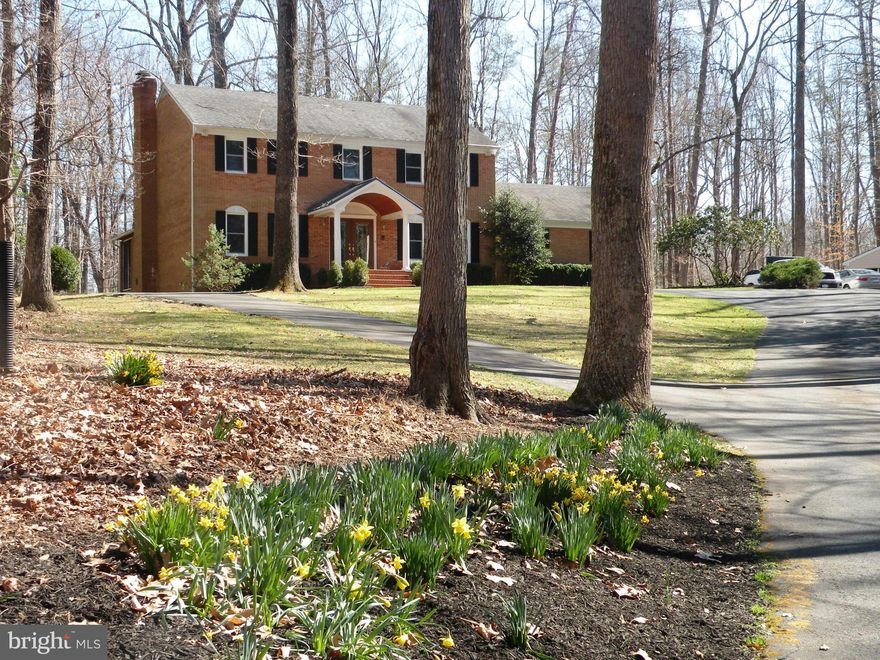 Classic beauty all brick home on 2 acres in prestigious Fairfax Station Gated entrance. Winding circular driveway. State of the art front porch. Marble foyer.HW floors. 2 fplcs.Gourmet kit w island,granite counters,SS appliances,new Pella windows. Fin w/o basement w covered patio New Hot Water Heater.Enclosed Porch.New deck.Oversized grg w epoxy floor.Seller to provide HW w/Cardinal Title closing.