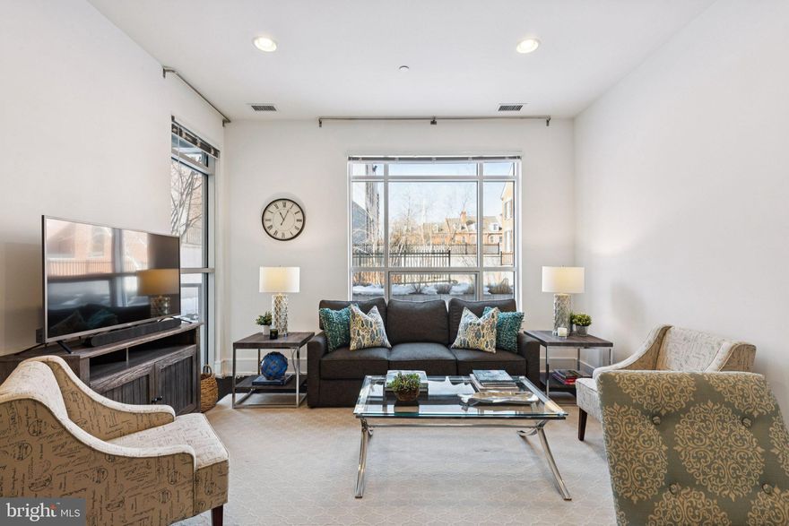 Experience refined city living in this expansive newer-construction one-bedroom, one-bath residence with private balcony and garage parking at 410 at Society Hill. Designed with soaring ceiling heights, wide-plank flooring, and oversized windows that fill the home with natural light, the open living and dining area flows seamlessly to a private balcony overlooking the serene community garden, offering a rare indoor-outdoor lifestyle. The chef’s kitchen features stainless steel GAGGENAU appliances, quartz countertops, sleek cabinetry, and a generous breakfast bar. The spacious bedroom suite includes a custom walk-in closet and a spa-inspired bath showcasing marble tilework, a storage vanity, and a large glass-enclosed shower. Additional highlights include Bosch in-unit laundry and individually controlled HVAC and hot water systems discreetly located outside the residence — maximizing interior space while enhancing comfort and quiet. Residents enjoy premier amenities including a 24-hour concierge, residents’ lounge, landscaped central courtyard, bicycle storage, secure garage parking, and a stunning rooftop deck with sweeping river and city skyline views. Perfectly positioned in the historic Head House District of Society Hill, this elegant, pet-friendly home is just steps from acclaimed dining, boutique shopping, cultural landmarks, Penn’s Landing, and convenient transportation.