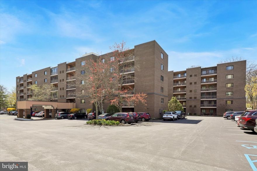 Rarely, an exceptional unit becomes available in this popular and sought-after condominium building.  This expansive 2 bedroom spans 1,156 sq. ft. and boasts numerous high quality custom features.  
 
Note** *The 2nd bedroom was converted into a den/study open to primary bedroom.

The open floor plan begins with a convenient coat closet and unfolds into a stunning eat-in kitchen.  Featuring very ample cabinetry pull out drawers, pantry closet and large island with seating,   This space is perfect for culinary enthusiasts.  The built in desk unit and Corian countertops add to the kitchen's functionality and elegance.
Adjoining the kitchen, the spacious living room and dining area is adorned with exquisite custom wood built-ins and opens onto a large screened-in balcony.  This outdoor oasis is ideal for al fresco dining or savoring morning coffee in tranquility.
A hallway leads to a full hall bath equipped with a tub/shower combo, custom cabinetry, and generous storage options.  The unit also features a convenient washer/dryer closet and linen closet for added utility.
The master bedroom is a sanctuary of comfort, complete with a walk-in closet and an additional closet.  It opens to  the serene 2nd bedroom  replete with custom built-ins and a large closet  (the space was originally designed as a second bedroom) which can easily restored back if desired.   The master bath  features a custom wood vanity with Corian countertop, ample storage and a large beautifully tiled shower. 
Throughout the unit, light hardwood and bamboo flooring, complimenting the custom plantation shutters and door.  The timeless wood built-ins add warmth and character to this space.  
The condo fee is a very reasonable at $555 per month, encompassing common area maintenance, security, trash, sewer, insurance, pool access and lawn maintenance.  Additionally, the building boasts a staffed desk six days a week from 4:00pm- 10:00pm offering extra convenience and peace of mind.   The one time capital contribution is 3 months of condo fee. 
Locations is key, and this unit is conveniently situated close to shopping, Whole Foods, a variety of restaurants and the train, making it perfect for those seeking both comfort and accessibility.  
This unit is a timeless and elegant residence, ideal for those seeking a sophisticated and convenient lifestyle.      
Please note that the washer/dryer is not working.