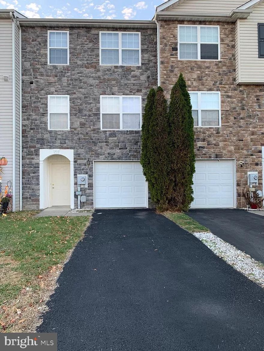 Prime location -Sunny and Spacious – Three level, three Bedroom  Two Full and Two Half bathroom, One car Garage townhome In Great Neighborhood of Mills Farm! New Paint, New Flooring, New Counter Tops. This absolutely immaculate home has Luxury flooring on all three levels. Freshly painted with neutral colors. Luxury renovated bathrooms.  Main level features formal dining, Gourmet kitchen with new countertops, large pantry, cabinets, appliances. The spacious living room has sliding glass door. The upper level boasts the owner's suite with adjoining bath. Large closet. Two additional bedrooms, a full bath complete the upper level. The lower level includes recreation room and half bath. Prime location!