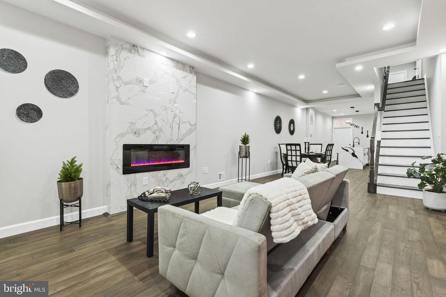 Experience modern city living at its finest in this beautifully finished 3-bedroom, 3-bath home priced at $320,000. This stunning property features exposed brick walls, tray ceilings, and hardwood floors throughout, enhancing its charm and elegance. The chef’s kitchen showcases a 9-foot island with quartz countertops and stainless steel appliances, perfect for entertaining. Enjoy the 13x16 rooftop deck and 6x13 first-floor deck, ideal for relaxing outdoors. Additional highlights include a fireplace, three exits, wood fencing, fire-rated walls, and a rubber roof with a 3-year warranty. With 9+ ft ceilings and a CHAP tax credit offering approximately $568 in monthly savings ($6,811 annually), this home delivers luxury, value, and style in one exceptional package. The Seller will prefer to use Cardinal Title Group at White Marsh, MD.