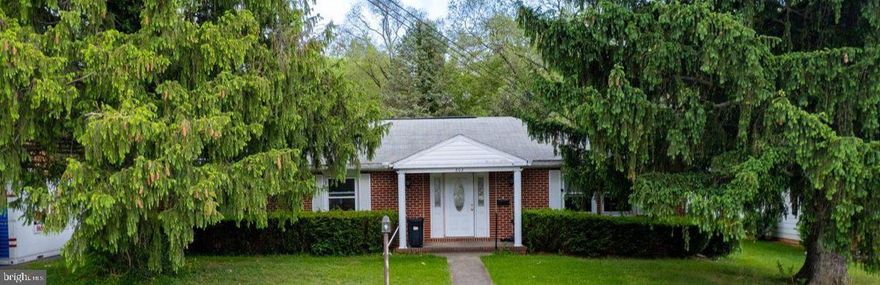 This charming ranch-style home in Martinsburg City offers a perfect blend of comfort and investment potential. Built in 1969, this well-maintained brick residence boasts 1,680 sq. ft. of inviting living space, featuring three spacious bedrooms and two full bathrooms. The traditional floor plan is designed for both relaxation and entertaining, with a family room that flows seamlessly from the eat-in kitchen, ideal for gatherings. Investors will appreciate the hardwood floors that add warmth and character, while the two fireplaces create a cozy ambiance during colder months. The kitchen is equipped with essential appliances, including a single oven, range hood, and convenient pantry space, making meal prep a breeze. The main floor laundry, complete with washer and dryer, enhances the home's functionality. Outside, the property sits on a generous 0.24-acre lot, featuring a side-entry attached garage and a paved driveway with ample parking for guests. Enjoy outdoor living on the patio or porch, perfect for morning coffee or evening relaxation. With its desirable location and solid construction, this home presents an excellent opportunity for rental income or long-term appreciation. The combination of interior comforts and exterior appeal makes this property a wise investment choice for those looking to expand their portfolio in a thriving community. Don't miss out on the chance to make this house your next successful investment!