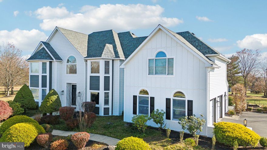 Welcome to your dream home nestled on a 2-acre lot in the prestigious estate community of Hillcrest Meadows with no HOA! This estate style home boasts space for everyone across three levels. The elegant two-story foyer welcomes you in and is flanked by a formal living room complete with a fireplace and a formal dining room. French doors in the living room open into the dedicated home office, or is this the perfect playroom. It features a wall of built-ins and opens right up into the two-story family room.  The floor-to-ceiling stone fireplace and huge windows really create the ideal atmosphere for relaxing or entertaining. The chef's kitchen will wow culinary enthusiasts with a 36" gas range, beautiful tiled flooring, custom cabinetry, an oversized island with seating, and a coffee bar that leads right into the formal dining room.  A laundry room and mud room off both the driveway and garage is the perfect drop zone to keep all your daily items out of sight. The open staircase leads upstairs to the primary bedroom behind French doors with a bay window, two walk-in closets featuring custom built-ins, and a spa-like ensuite with soaking tub, makeup vanity, double sinks, and a glass-enclosed walk-in shower. Across the cat walk is one bedroom that would make another great home office with a window seat and a wall of built-ins. A princess suite, two other bedrooms, and a full hall bathroom finish off this level. Descend to the basement from the back stairwell that leads to the kitchen and basement. The fully finished basement is a great recreation room to fit your needs and features a full bathroom and walk-ups to the backyard oasis. Enjoy the outdoors on your Mediterranean-style back deck and patio boasting a built-in fireplace with seating and a built-in grill with storage. It's surrounded by meticulously landscaped gardens/flowers that bloom throughout the season, plus it has an irrigation system. Enjoy peace of mind with brand new Hardiboard and vinyl siding that replaced stucco in November of 2024! Experience serene, park-like living in a quiet neighborhood that's conveniently close to everything.