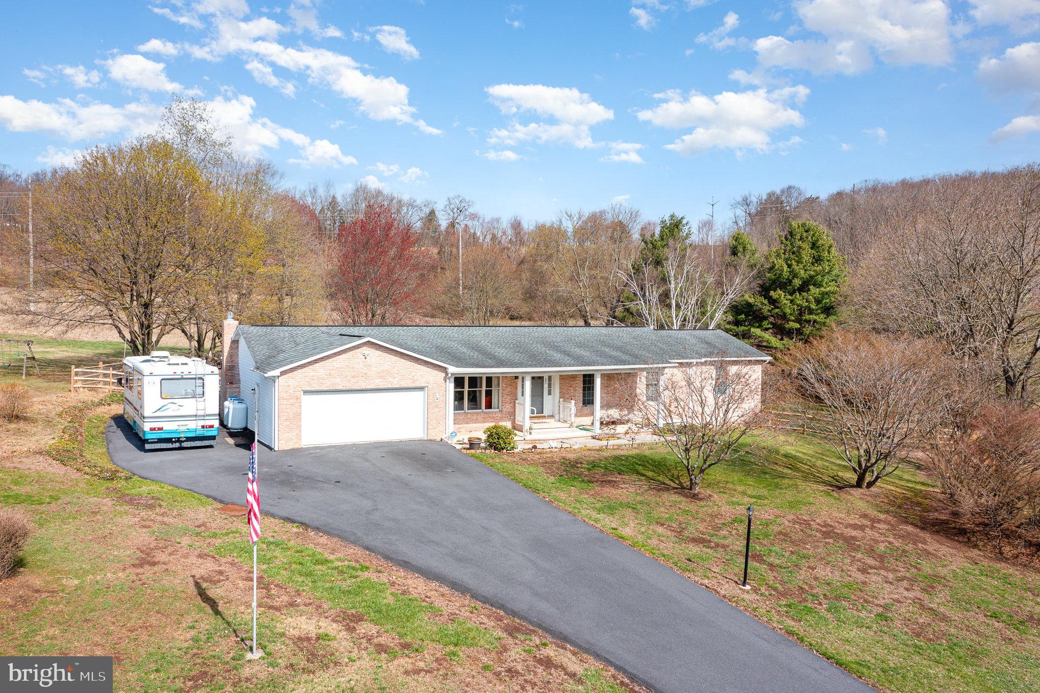 Welcome to 14 Murray Meadows Lane!! Nestled on a serene 1.2-acre lot, this beautifully maintained brick ranch offers the perfect blend of comfort, space, and elegance. Boasting 4 bedrooms and 4 full baths, this home provides plenty of room for family and guests alike. Step inside to discover brand-new flooring throughout, enhancing the bright and airy layout. The family room features an efficient propane fireplace, creating a warm and inviting atmosphere. Entertain with ease in the private dining room, which flows seamlessly into the light-filled three-seasons room—perfect for morning coffee or evening relaxation. The home features an oversized master suite, with generous closet space and private bath, offering a luxurious and flexible living arrangement. With central air and ample storage throughout, comfort and convenience are guaranteed. New! New! New! Sellers replaced the heating and cooling system, well pump and blue tank and water heater ... so rest assured that the mechanical portion of the home is ready for years of use. Enjoy the peace and privacy of your expansive property, ideal for outdoor gatherings, gardening, or simply soaking in the natural beauty. This rare gem combines traditional charm with modern updates—don’t miss your opportunity to own a slice of paradise!