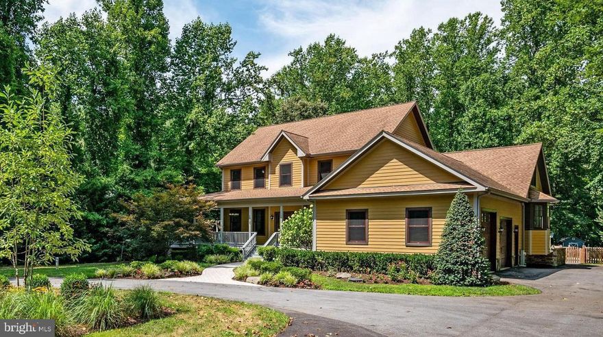 *Offer deadline - Sunday at 7pm*. Your Exclusive Retreat!  This magnificent estate spans over 6,200 square feet, offering ample space for everyone to live and be comfortable on 4 acres of your own private land. The first thing you will notice is the circular drive and ample parking for you and all of your guests. This meticulously landscaped yard draws you in as you walk up the steps of your wrap-around porch. The front door details the old world charm with modern comforts that await you. As you head inside, you'll be greeted by a private office adorned with coffered ceilings and a dual-sided fireplace, creating a warm, yet elegant workspace that inspires productivity and comfort. The formal dining room is to your right, featuring exquisite crown molding, a stunning mural and generous space for your hutch or buffet. It is perfect for hosting dinners and entertaining guests. Opposite the gas fireplace, you will find the spacious living room with built-in bookshelves and windows overlooking the side and rear screened porch.  Adjacent to the living room, you'll be in love with the breathtaking two-story gourmet kitchen, a true chef's paradise. This culinary haven includes granite and butcher block countertops, custom cabinetry,  a second prep sink and island,  a stunning tile backsplash, under-cabinet lighting, a spacious breakfast bar, pot rack, and you’ll be the envy of all your friends with a top-of-the-line AGA gas range. The bright breakfast area at the rear of the main level, bathed in natural light from all the surrounding windows, provides the perfect spot to enjoy your morning coffee and look out towards your beautiful backyard oasis.  Between the kitchen and dining area, enjoy your butler's pantry with additional storage and a wine fridge. The perfect coffee/espresso station awaits, just steps away from your bedroom. The main level also features a luxurious primary suite with dual walk-in closets, and an opulent private bathroom. This spa-like retreat includes a dual sink, an oversized vanity, elegant tile flooring, a large shower, tv and a jetted soaking tub, ensuring ultimate relaxation. Additionally, a convenient laundry room and a powder room are located on the main floor. Upstairs, an open loft area with a built-in desk and recessed lighting offers an ideal space for study or relaxation. This level includes four bedrooms: two with private full bathrooms and two sharing a "Jack-and-Jill" full bathroom. Another laundry room on this floor adds to the home's convenience. Next, head to your bonus finished basement! It is the perfect versatile space, featuring a spacious recreation room with rough-in plumbing for a future kitchen, making it perfect for an au pair or in-law suite. The basement includes another private office or den (which could serve as a playroom, homeschool area or home gym), a finished storage room, a game/billiards room, a  large media room with a wet bar, another large bedroom with adjoining full bathroom, and an unfinished storage room with shelving. You even have a separate walkout access to the outside. The exterior of this home is an outdoor lover's paradise! Your in-ground gunite, saltwater pool is heated, has lights and an easy electric cover to protect it from the fall leaves.  Just steps off the pool, you'll find your covered stone pavilion for seating, watching tv and an outdoor fireplace for those chilly fall evenings. The rear composite deck has its own exit off the primary bedroom. You are steps away from your new hot tub with gazebo.  To the side is your oversized two-car garage (one taller for an RV and includes an RV receptacle).  Additional notable features of this home include a backup generator, an invisible dog fence, fully fenced in chicken coop area with additional shed storage, new carpet, fresh paint, and much more. This is a must-see property that seamlessly combines luxury, comfort, and functionality in every detail.  Close to all major highways, DC, and Annapoli
