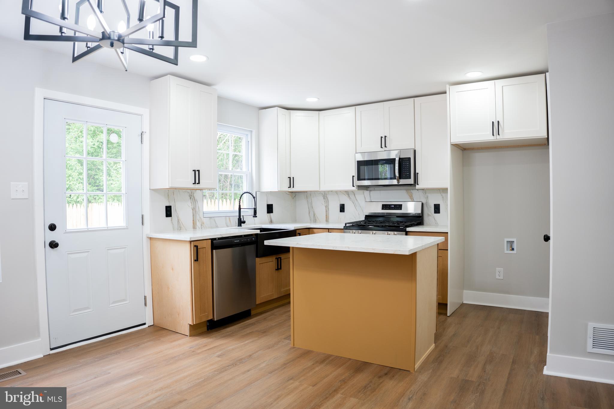 Welcome to this exquisite 4-bedroom, 2 1/2-bathroom home nestled in the desirable West Philadelphia area. Meticulously renovated with thoughtful finishes throughout, this home seamlessly blends modern luxury with timeless charm. Upon entering, you're greeted by an inviting open floor plan with an expansive living and dining space leading you to an open chef's kitchen. The kitchen boasts modern style cabinets, elegant stone countertops, and state-of-the-art stainless-steel appliances, making meal preparation a joy. Natural light floods the space through ample windows and doors which floods light directly into kitchen creating a feeling of warmth and peace. Envision your perfect outdoor oasis on the potential concrete patio fenced around, perfect for morning coffee or evening relaxation. The home's lower level is a versatile space, offering a finished basement complete with laundry and 4th room or office, ideal for guests, extended family or roommates to enjoy privacy while helping cover expenses. The principal bedroom is a true sanctuary, boasting walk in closet , large windows that adds a unique touch of character and charm and his private master bathroom. Another two great size bedrooms with another bathroom are perfectly located next to the master bedroom. Located on a charming block with own driveway and plenty private parking spots, this home offers both convenience and tranquility. Situated on the one of quietest blocks in the area, enjoy easy access to transit routes and local conveniences such as shops, restaurants and green spaces. Seller is motivated to consider your offer. Schedule your showing today!