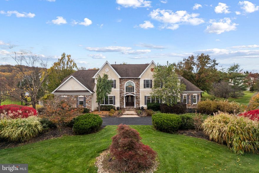 Welcome to 63 Woodside Lane, a stately colonial located on one of the most desirable lots in the gorgeous River Crossing neighborhood, with exquisitely designed interior, and the award-winning Council Rock School District.  The house has an expansive view to appreciate naturally landscaped open space.  This home features 4 bedrooms, 4.5 baths with a 1900+ sq.ft. finished lower level.  As you step into the elegant 2-story foyer, you will be greeted with gold filigree wood moldings and hand-painted murals. The formal living room and dining room showcase custom hand-painted ceiling and provide the perfect backdrop for elegant entertaining. Create wonderful memories around the table with family and friends. The kitchen will be your favorite happy place with  center island and modern appliances including Viking 5-burner gas stove, exhaust hood, double oven and lovely views.  The open space extends into the breakfast room, adjacent bonus sunroom and family room, providing panoramic views of the sprawling private back yard. The composite deck and custom stone patio offer 3 season outdoor dining and relaxation. Curl up with a great book and just get lost in the backyard oasis for awhile. Work from home? Appreciate the tucked away private office with beautiful built-ins. The sun-drenched conservatory provides great entertaining space or a wonderful place to enjoy music. A powder room, laundry/mudroom and access to the 3-car garage complete the 1st floor. Follow the elegant wood curved staircase to the 2nd floor which boasts 4 bedrooms and 3 full baths. The primary bedroom boasts a tray ceiling, sitting room/exercise room, walk-in closet, and ensuite luxury bath with vaulted ceiling, dual vanities with quartz counters, jetted tub and separate stall shower. Bedroom #2 provides a ensuite full bath with shower/tub and two large bedrooms share a Jack and Jill bath. Don't miss the finished walk-out lower level with spacious recreation room, game room area, two additional finished rooms, a full bath and storage/workshop area. Special features include a new roof (2013), Generac whole house generator, furnace and 2 new A/C units (2022), well pump and wiring (2021), extensive stone walkways & patio (2023), water softening system (2022). Located within commuting distance to Princeton, Philly, and NYC. Don’t miss the opportunity to live the quintessential Bucks County lifestyle in your beautiful new dream home.