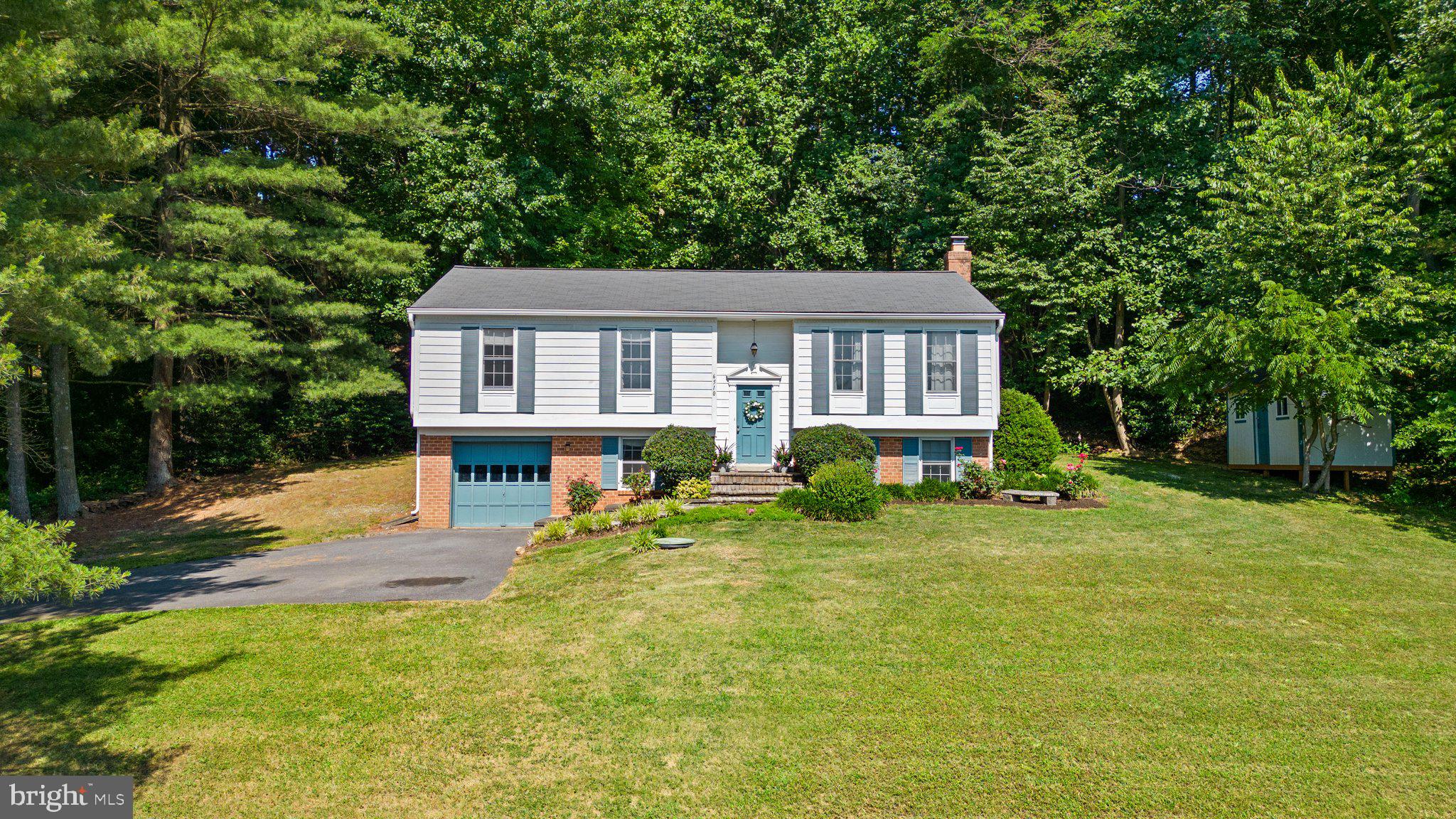 Seller says bring offers! Welcome to 6510 Carrie Lynn Ct, located in desirable Mount Airy and just minutes from Main Street. You’re immediately greeted by lush landscaping along the front walkway. Inside a spacious kitchen awaits with all appliances included in the sale, large living and dining rooms, and three bedrooms and two full baths. The primary bedroom has its own bathroom which was just remodeled and features gorgeous tile work. The lower level features an additional bedroom, half bath and a recreation room with woodburning fireplace. One car garage. Washer and dryer. CAC approximately six years old. Community offers a private Lake right across the street! It's summer so bring your boat and fishing rods! HOA fee covers lawn cutting around lake.