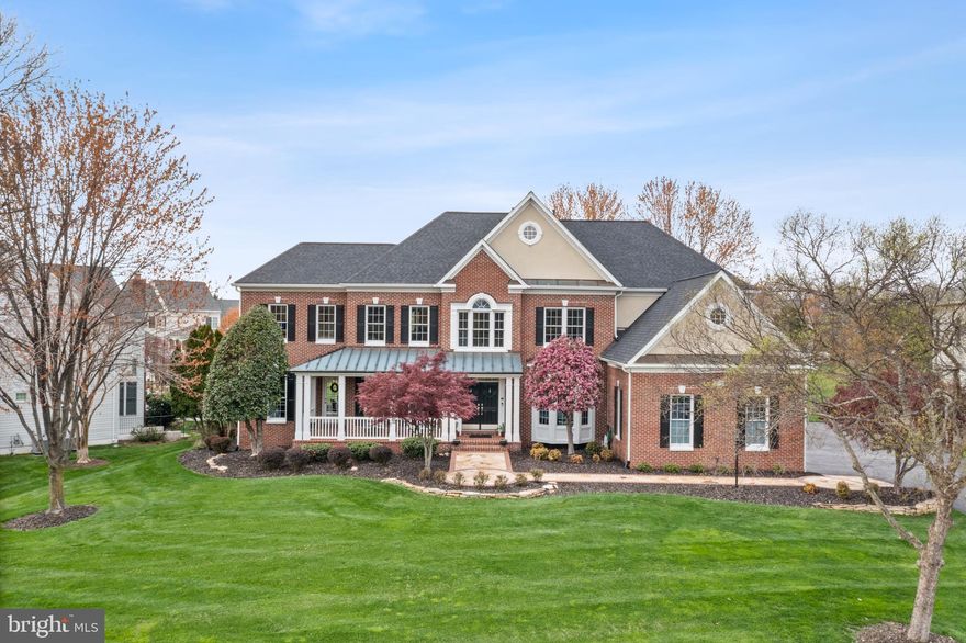 Welcome to your dream home nestled in a quiet, picturesque cul-de-sac on one of the most coveted streets in Ashburn. This stunning one-of-a-kind modified Winchester Browning was customized to provide unparalleled elegance and livability. This meticulously maintained home is on a beautiful ½ acre lot with an inground sprinkler system, mature trees, and a gorgeous flagstone front walkway. The house features 4 ensuite beds, 5.5 baths, 2 home offices, 2 private basement level flex rooms next to full bath with over 5,000 sq ft of living space on the top two levels plus 2000 sq ft of finished space in the basement (county records are incorrect). The main level has 9' ceilings, a massive eat-in kitchen featuring GE Monogram appliances, granite countertops, double ovens, and a large island. An intuitive, whole house smart home system has been seamlessly integrated to incorporate the lights and alarm/camera system. Custom trim complements the dramatic dark solid hardwood floors that flow throughout. Upstairs, the expansive primary suite has a separate sitting area, light and bright flex area, and an updated bathroom with quartz countertops, separate vanities, and a heated floor. Each generously sized bedroom has its own walk-in closet and upgraded ensuite bathroom. Stay comfortable year-round with a multi-zone, multi-stage HVAC system, granting individual temperature control for each bedroom. The basement is primed for entertainment with an impressive wet bar area featuring granite countertops, beverage refrigerators, 2 tap kegerator, and 2 wine coolers with space for 364 bottles. The home theater is equipped with a 100” projector, 2 additional TVs, and integrated surround sound for the ultimate movie or sports experience. Additional flex space, gas fireplace, upgraded full bath, and large unfinished storage area round out the lower level. Outside there are over 1000 sq ft of screened-in porch and deck for endless outdoor enjoyment. The 3-car garage features wiring for 2 electric car chargers, epoxy flooring, slatwall organization system, and built-in cabinets and storage racks for optimal functionality. The exterior of the home was constructed with low-maintenance materials and has been impeccably maintained. Notable upgrades include a new roof with 6” gutters (2019), a Hubitat smart home system (2020) integrated to all core components of the property, upgraded bathrooms, and so much more. See the documents section for an impressive list of home improvements. With all of the hard work already done, the only thing needed is a new owner! Don't miss the iGuide tour for a personalized walkthrough of the property!
