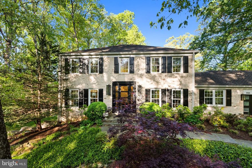 Tucked at the end of a private, wooded pipestem in the highly coveted Fox Heritage, this fully renovated colonial offers a rare blend of privacy, architectural presence, and refined, high-end design—set on nearly an acre within an intimate enclave with access to a private lake and nearby trails.

A large, striking front door with expansive glass panels and matching sidelights creates a dramatic, light-filled entry, opening to a soaring two-story foyer anchored by a sculptural, winding staircase. Just beyond, the dining room—positioned immediately off the foyer—welcomes you with expansive windows framing serene woodland views. Throughout the home, windows flank nearly every room, flooding the interiors with natural light and drawing the outdoors in.

The main level unfolds with intention—open, connected spaces elevated by new white oak hardwood floors that bring warmth and continuity throughout. The kitchen serves as the true heart of the home—bright, open, and completely reimagined with clean-lined cabinetry, statement lighting, and a large island that naturally gathers people for both everyday living and entertaining. A well-positioned laundry and mudroom just off the kitchen adds everyday practicality without disrupting flow.

Connecting these spaces is a dedicated home gym, thoughtfully situated between the library and mudroom, offering both convenience and flexibility with durable flooring and custom built-in storage. Nearby, tucked between the kitchen and foyer, a quiet library lined with custom wood built-in bookcases provides a refined retreat—an intimate space designed for reading, focus, and escape.

The fully finished, walk-out basement is designed for both relaxation and entertaining, featuring a built-in projector and screen with embedded surround sound, a granite wet bar, and seamless access to the outdoor patio. Just outside, a private hot tub sits within heated flagstone—allowing for year-round enjoyment without stepping into snow or ice. A large storage room and flexible living space add even more functionality.

Upstairs, four spacious bedrooms and three fully renovated baths continue the home’s cohesive design. The owner’s suite bath is a true showpiece—featuring a natural stone walk-in shower with high-end fixtures and a dramatic skylight that fills the space with natural light, creating a spa-like retreat. One secondary bedroom offers an ensuite bath with floor-to-ceiling windows and a striking rough-cut stone sink. Closets throughout are outfitted with integrated lighting that activates upon opening, adding both convenience and a subtle sense of luxury.

Outdoors, the nearly acre setting is both expansive and private. The backyard offers a large grassy area ideal for play or entertaining, a storage shed for added convenience, and mature trees that create a natural, secluded backdrop. Stonework, patio spaces, and outdoor lighting extend the living experience into the landscape.

Completing the home is a two-car garage with smart, app-controlled doors, seamlessly integrating modern convenience into everyday living.

Extensively renovated across multiple phases, the home features updated multi-zone HVAC systems, new windows capturing wooded views, a gas line installation, upgraded mechanicals, and modern touches including USB and USB-C outlets throughout.

A rare offering—where thoughtful design, meaningful upgrades, and a truly private setting come together in one of Fairfax’s most desirable communities.