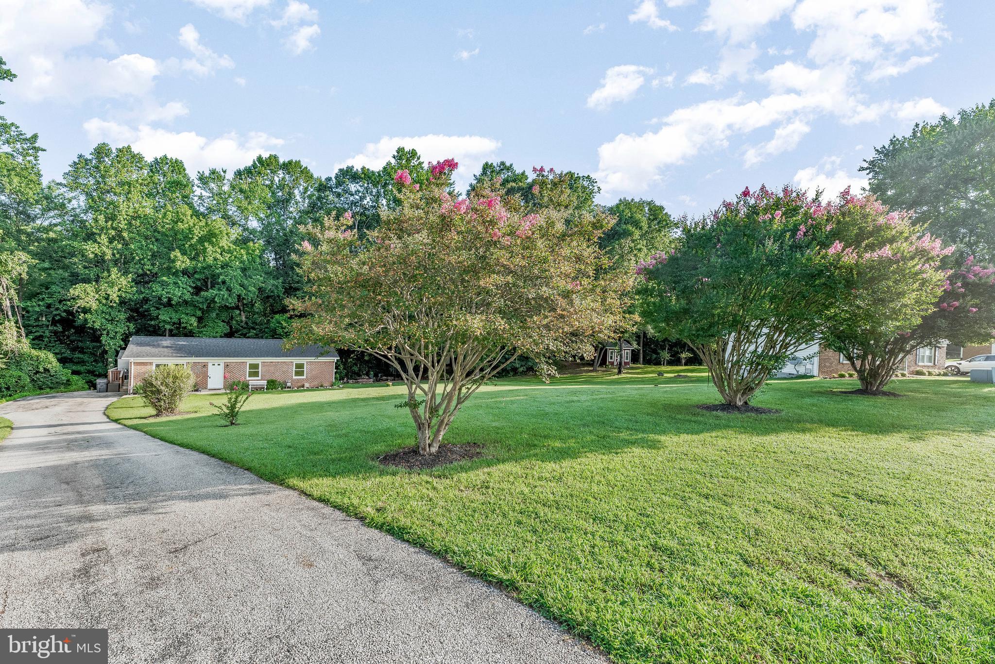 Welcome to 38440 Laurel Ridge Ct, a charming one-story brick rambler nestled on a quiet cul-de-sac in Mechanicsville, MD. This delightful 3-bedroom, 1-bathroom home offers just over 1100 square feet of meticulously updated living space, situated on an expansive (almost) 1 acre lot. Step inside to discover a thoughtfully remodeled interior boasting luxury plank flooring throughout, providing both elegance and durability, alongside a fully updated kitchen with sleek stainless steel appliances and tall white cabinetry, perfect for the home chef. The bathroom has also been beautifully remodeled, offering a fresh and modern feel. You'll appreciate the convenience of a full-sized laundry room in the hall just off the bedrooms. All bedrooms are a great size and should hold bulky furniture, no problem. The exterior of this home is just as inviting, featuring a huge, flat front yard ideal for outdoor activities (swing sets, corn hole, cook outs and so much more), and a big back deck that's perfect for entertaining or simply relaxing while enjoying the serene views of the trees that back of the home faces. For all your storage needs, a large storage shed with tall ceiling height is ready to accommodate tools, equipment, or hobbies (with a little TLC). This property also boasts an exceptional commute-friendly location, offering easy access for those working in Washington D.C., Andrews AFB, and PAX Naval Base. This rambler truly offers the perfect blend of modern updates, spacious outdoor living, and a prime location—don't miss the opportunity to make this peaceful retreat your own!