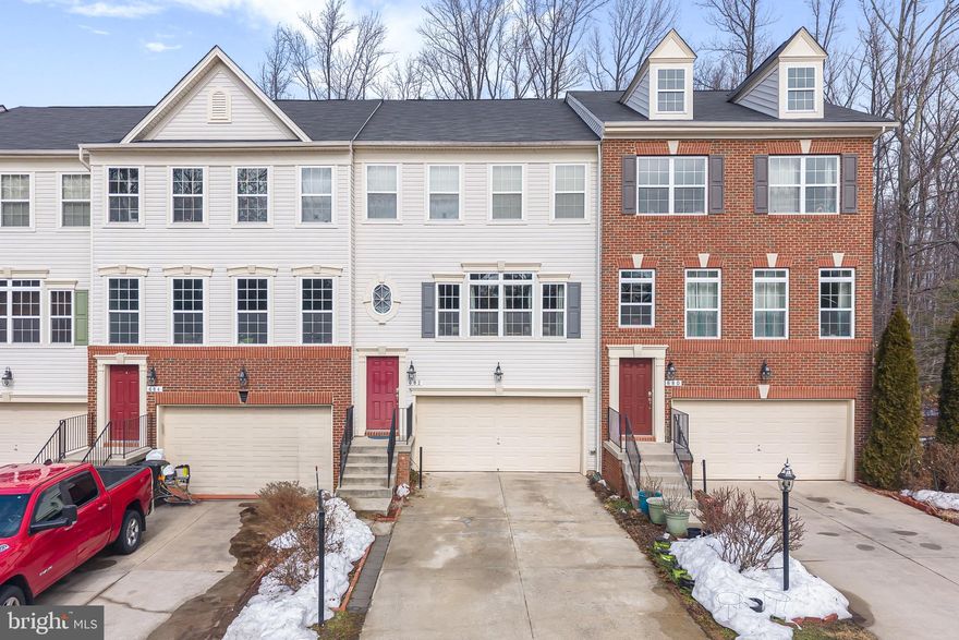PRICE REDUCTION! SELLER IS MOTIVATED AND OFFERING A PAINTING CREDIT. 
Nestled in the charming Millhouse Creek community, this beautifully designed Colonial townhouse offers a perfect blend of modern comfort and timeless elegance. Built in 2014, this home boasts 2,440 square feet of thoughtfully finished living space, making it an ideal sanctuary for those seeking both style and functionality. As you step inside, you are greeted by a warm and inviting atmosphere that flows seamlessly throughout the open-concept layout. The adjoining dining area provides a lovely setting for meals, whether casual or formal. This home features three generously sized bedrooms, providing plenty of room for relaxation and personalization. The master suite is a true retreat, complete with an en-suite bathroom that offers both convenience and privacy. With two full bathrooms and two half bathrooms, morning routines and guest visits are effortlessly accommodated. The fully finished basement adds an extra layer of versatility to this home, perfect for a home office, playroom, or media space. With interior access, this area is both functional and inviting, allowing for endless possibilities to suit your lifestyle. Outside, the low-maintenance yard offers a quaint space for outdoor enjoyment without the burden of extensive upkeep. The attached garage with front entry provides convenient parking and additional storage, ensuring that your home remains organized and clutter-free. Located in a vibrant community, this townhouse is just moments away from local amenities, parks, and recreational opportunities, making it easy to enjoy the best of suburban living. Whether you’re looking for a peaceful retreat or a place to create lasting memories, this home is ready to welcome you. Experience the perfect blend of comfort, style, and convenience in this delightful Millhouse Creek townhouse. Schedule your private tour today and discover the possibilities that await you in this inviting space!
