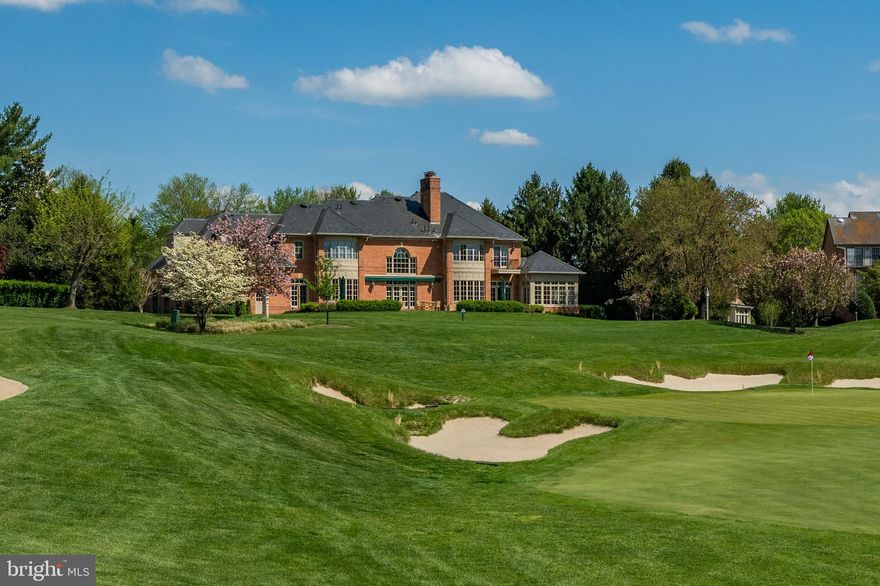 The Crown Jewel of Avenel!  The most Spectacular Views and Sunsets  of the TPC Golf Course at Avenel!

Offered for sale for the first time since its creation, 10 Beman Woods Court is undoubtedly Avenel's crown jewel. This custom estate was designed and developed on three and a third lots, strategically located at the turn of the 17th and 18th fairways of the TPC  Golf Course at Avenel.. The residence overlooks the 17th green and acres of lush fairways and a glistening pond.  Welcome home to unsurpassed, breathtaking views and sunsets from virtually every room and level of the residence. 

The owners and developer, Natelli Homes, designed the residence with the utmost attention to detail. Extra care in the siting of the home required the builder to construct several decks to be able to refine the views before deciding on the final siting and outline of the perimeter of the residence.
Constructed of top of the line materials and state of the art finishes, no detail was overlooked.

The exterior brick was laid with grout work that includes a grape vine effect hand crafted in the grout lines. Additional exterior features include custom pavers for the circular drive and motor court, designer landscaping, a flagstone patio, and a beautiful slate roof with snow birds and lightning rods. 

The interior finishes are in impeccable condition. Stunning hardwood floors throughout, custom millwork and trim, custom windows and doors, and elegant lighting are just a sample of the fine features included in the residence. There is a "surprise" in every room.

The welcoming entry foyer with sidelights and transoms opens to a spectacular view of the two-story living room with panoramic vistas of the golf course and pond.  The spacious living room with fireplace and double french doors lead to the flagstone patio and outdoor entertaining area with a remote-controlled awning. A remarkable mahogany paneled library to the right of the living room includes custom cabinetry, ample room for a partner's desk, conference table and all with breathtaking views of the 17th green, fairways, pond, and spectacular sunsets. Entertain in style in the oversized dining room, warm and inviting family room with alcove, fireplace, automatic shades and adjacent sun-room. This side of the house also opens to a flagstone patio with awning. The high ceilings, extra tall windows, transoms and doors all provide for a light filled residence, bringing the outdoors in throughout the home.   A cook's delight is found in the expansive kitchen complete with a breakfast room and pantry.  

Views from almost every room on the second level are equally breathtaking. The dreamy primary suite includes an alcoved sitting room looking out high over the 17th green, rolling fairways and pond. Additional features include multiple wardrobe and closet areas, a fireplace and sumptuous white marble primary bath with jacuzzi tub, shower, and wide vanity with double sinks.  Three additional spacious guest bedrooms with ensuite baths are located on this level.  A total of 5 bedrooms, 4 full baths with a large and spacious laundry complete the second level of the residence.

From the family room on the main level, venture down the staircase to the daylight walkout lower level entertaining area.  The wow factors continue with a double family room area, a custom wet bar (mini-Cheers bar), fireplace, pool table and table tennis room, game room, gym, sauna, steam shower, full bath and powder room.  No details were overlooked in designing the lower level which includes a huge storage room with access from two sides. The lower level outside entrance allows guests to navigate through the lush garden to the main level patio.

Additionally, the 3 car garage with motor court and circular drive provides ample space to park 12 cars.
Avenel provides full landscape maintenance, private surveillance,  swim & tennis club.