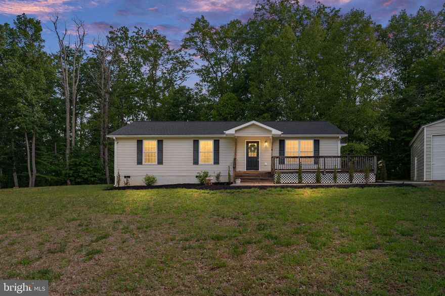 Positioned on a beautifully wooded lot with a welcoming presence from the moment you arrive, 3150 Sareth Lane offers peaceful one-level living, comfortable interior spaces, and a setting that feels tucked away while still remaining close to everyday conveniences. Built in 2004, this three-bedroom, two-bath home is surrounded by trees that create a cozy and private atmosphere, giving the property a warm and inviting feel year-round. As you approach the home, the setting immediately stands out with its attractive positioning and serene surroundings. Inside, the layout is open, functional, and designed for comfortable everyday living. The family room serves as the heart of the home, offering generous space for relaxing along with abundant natural light that pours in throughout the day. The large, open feel of the main living areas creates an easy flow between spaces while still maintaining a cozy atmosphere that guests immediately notice and appreciate. The oversized two-car detached garage is another standout feature, providing excellent storage space and flexibility for hobbies, tools, outdoor equipment, or additional organization needs. Outdoor living continues the appeal of the property. The backyard is level and usable with plenty of room for gatherings, outdoor activities, play areas, gardening, or entertaining. A rear deck offers a comfortable space to relax and enjoy the peaceful setting, while the surrounding woods and frequent wildlife sightings add to the property’s retreat-like feel. With very little through traffic nearby, the home offers an added sense of privacy and comfort. Recent updates include a new roof installed in September 2025, HVAC replacement in 2023, and a new sidewalk added in 2024, helping provide peace of mind for future owners. The location offers the perfect balance of serenity and convenience, with shopping, dining, and everyday necessities just a short drive away while still maintaining a scenic, tucked-away atmosphere. Comfortable, cozy, and welcoming, this home offers the perfect balance of convenience and privacy, a place where you can enjoy nature, unwind at the end of the day, and truly feel at home.